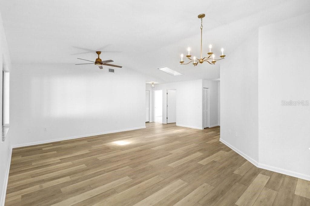 View from Kitchen/ Dinette to Living/Dining Room and Hall leading to Bedrooms/Baths and Hall Closet. - 4949 PLEASANT HOLLOW TRL #211, LAKELAND