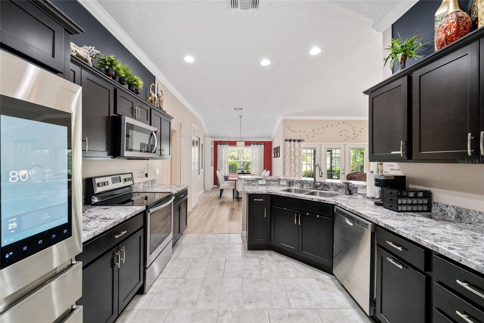 Espresso cabinetry, stainless steel appliances - 1194 MCDONOUGH PL, THE VILLAGES