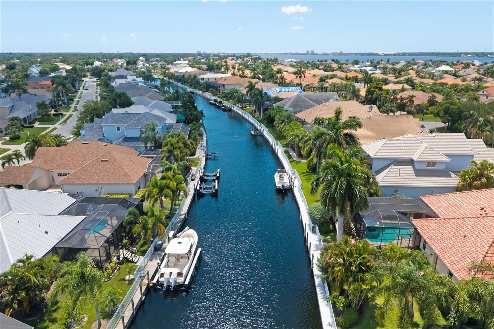 Backyard canal with boat dock, The Inlets behind the gates of Harbour Walk. - 4770 MAINSAIL DR, BRADENTON
