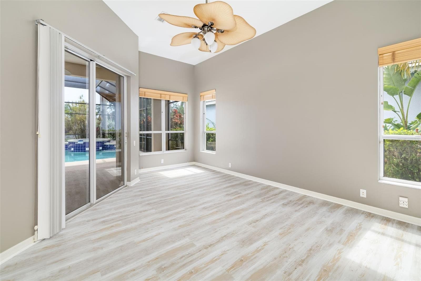 Private primary bedroom, with sliding doors leading out to the lanai and pool/spa, view of the canal and boat dock. - 4770 MAINSAIL DR, BRADENTON