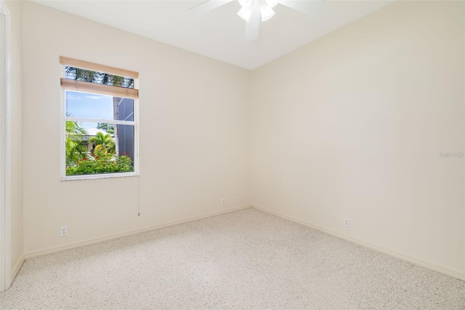 Bedroom two with large closet view of the Freshwater canal, towards the back of the home - 4770 MAINSAIL DR, BRADENTON