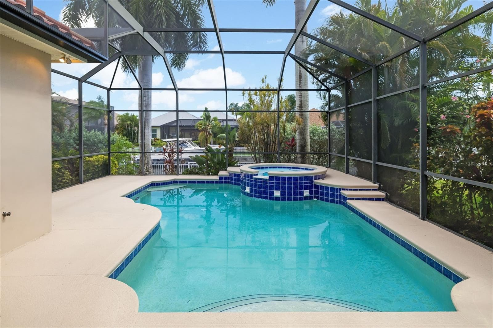 Private tranquil pool, with spa, space for entertaining guests, steps to your own boat dock and canal in your backyard - 4770 MAINSAIL DR, BRADENTON