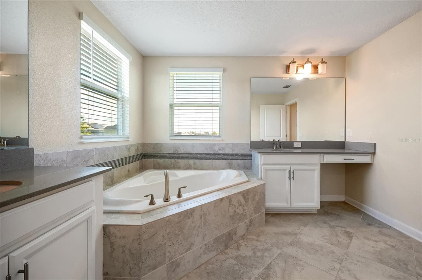 Primary Bathroom w/ dual-sink and plenty of natural lighting and garden tub - 12151 IMAGINARY WAY, ORLANDO
