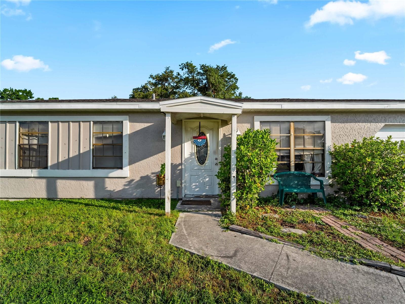 FrontExterior_1018RedBayTer_PortCharlotte_CoveredEntry_Daylight.jpg - 1018 RED BAY TER NW, PORT CHARLOTTE