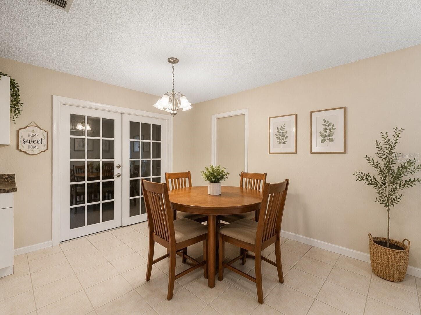 Virtually StagedDiningRoom_1018RedBayTer_PortCharlotte_NaturalLight_Entry.jpg - 1018 RED BAY TER NW, PORT CHARLOTTE