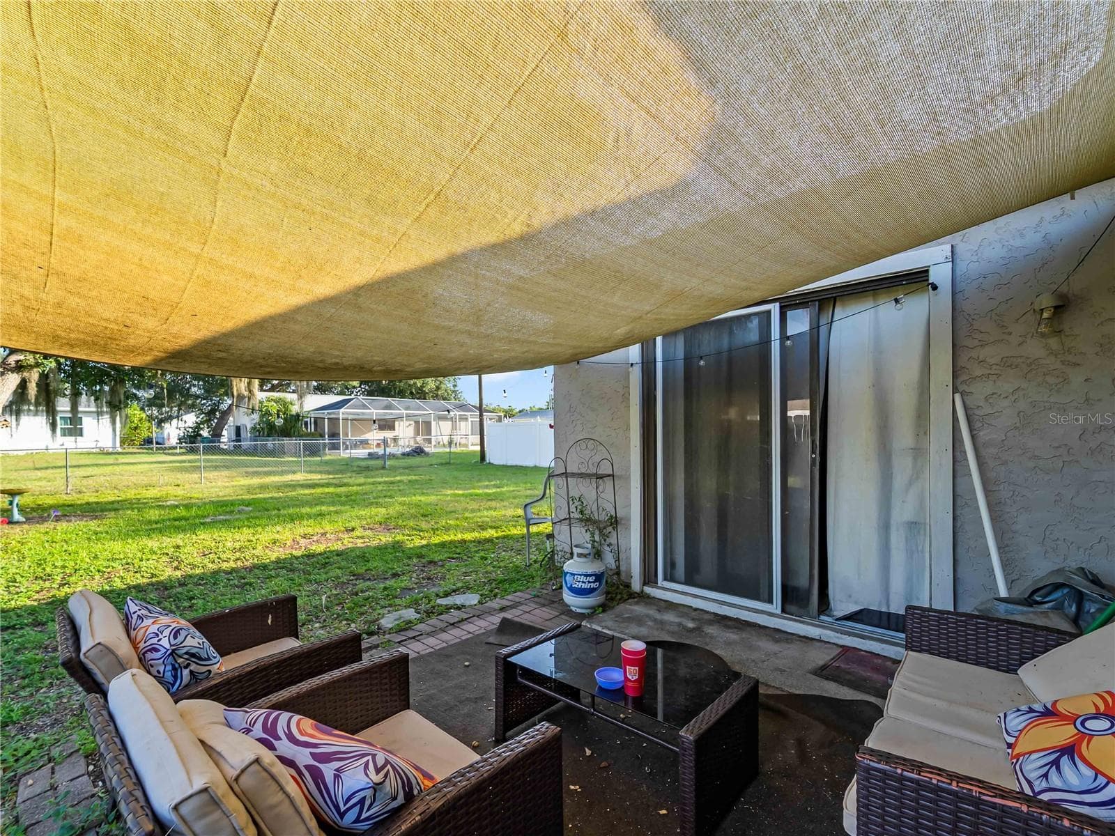 CoveredPatio_1018RedBayTer_PortCharlotte_OutdoorLiving_LanaiView.jpg - 1018 RED BAY TER NW, PORT CHARLOTTE