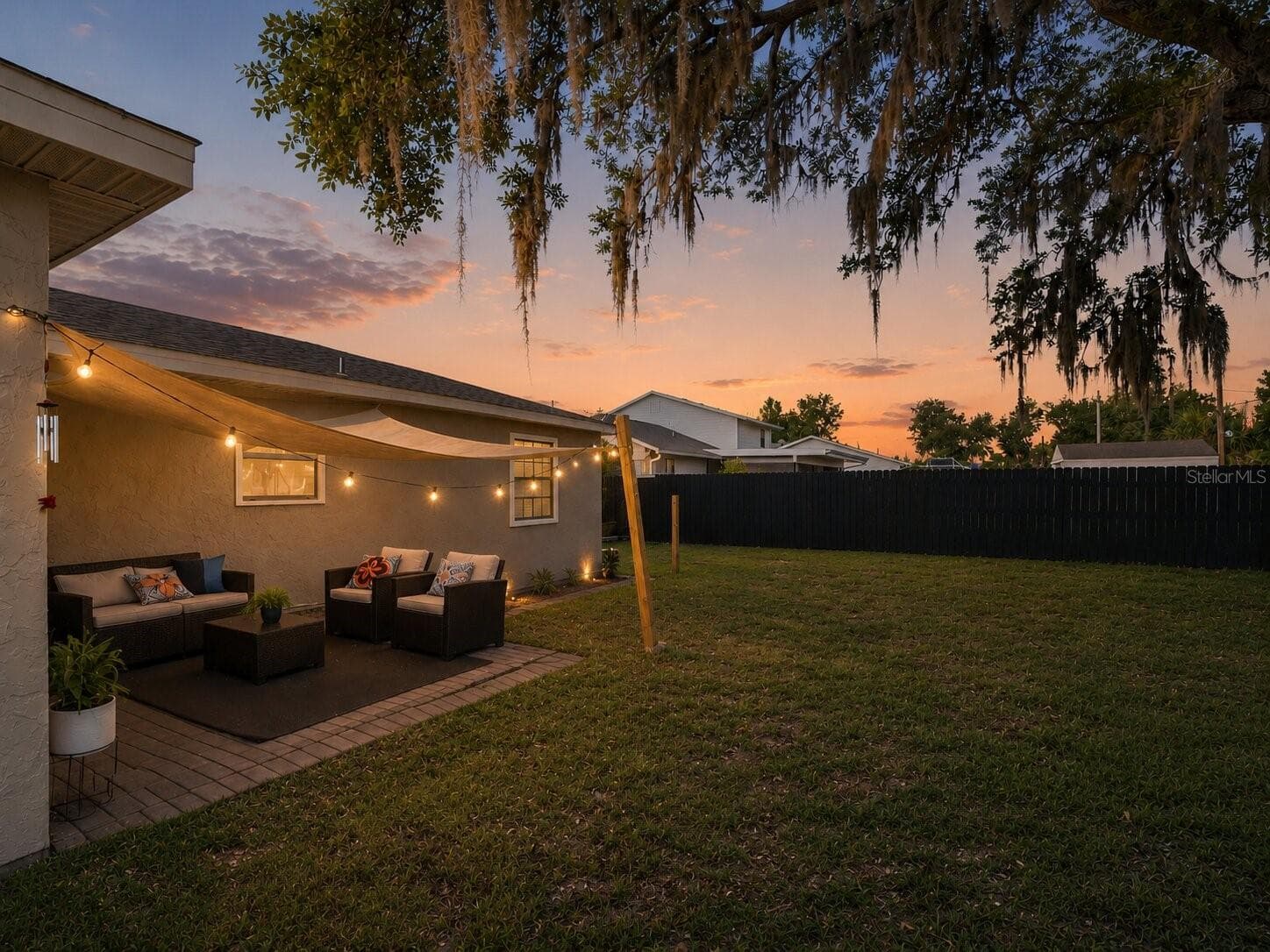 Twilight_Backyard_1018RedBayTer_PortCharlotte_FencedBackyard_Daylight.jpg - 1018 RED BAY TER NW, PORT CHARLOTTE