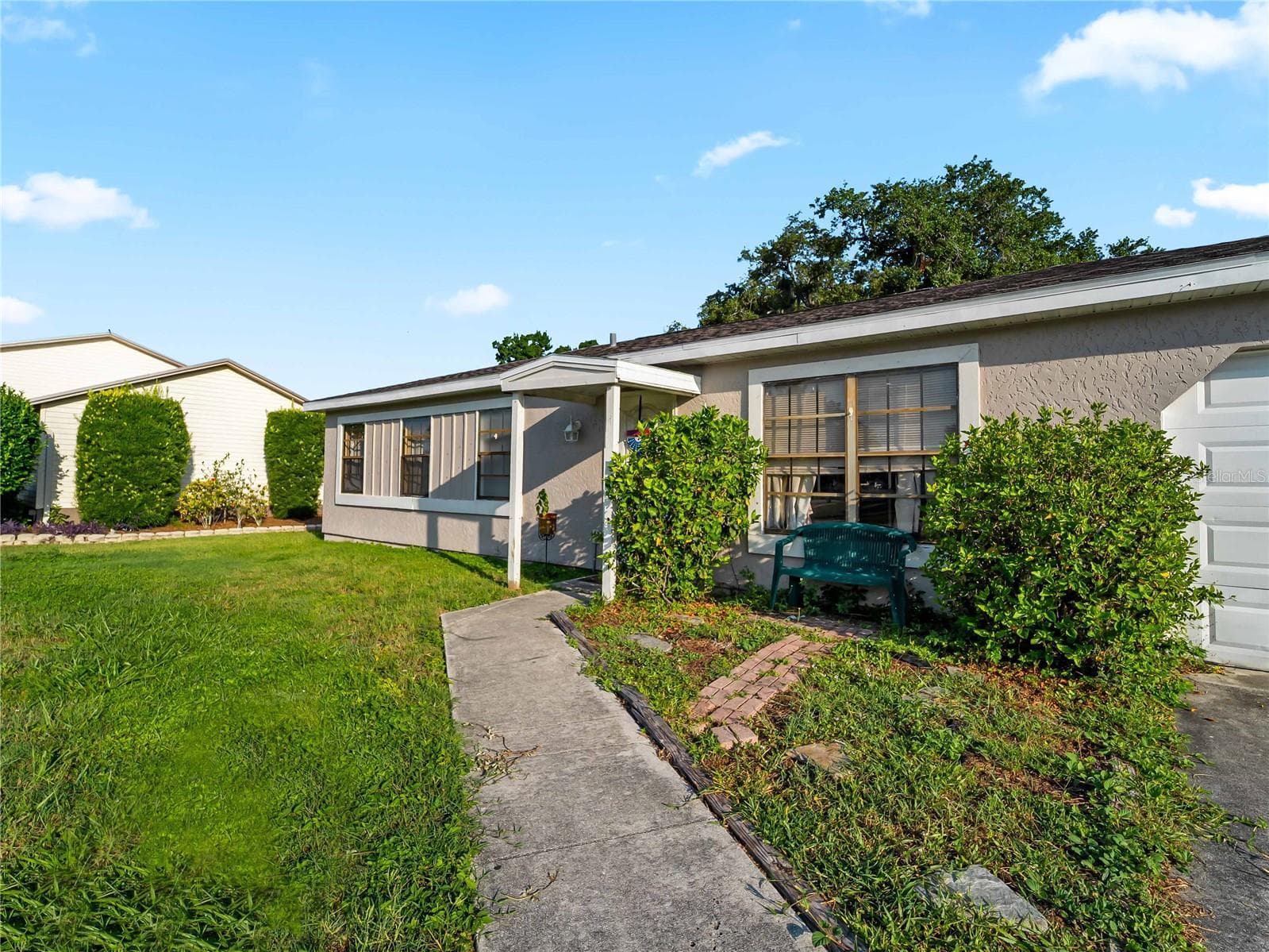 FrontExterior_1018RedBayTer_PortCharlotte_CurbAppeal_Corner.jpg - 1018 RED BAY TER NW, PORT CHARLOTTE