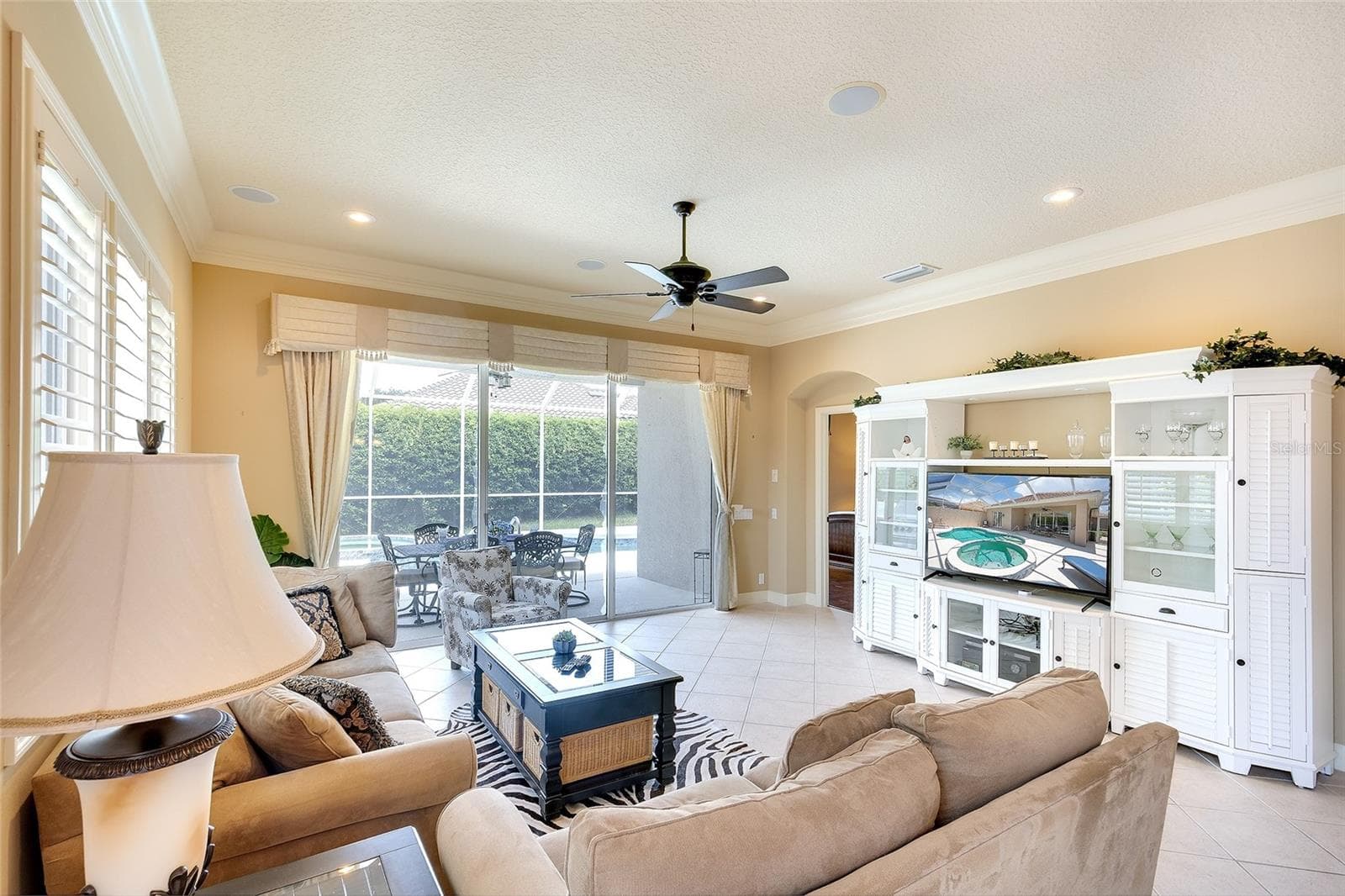 tile in all main living areas, crown molding, plantation shutters, neutral paint - 9735 53RD DR E, BRADENTON