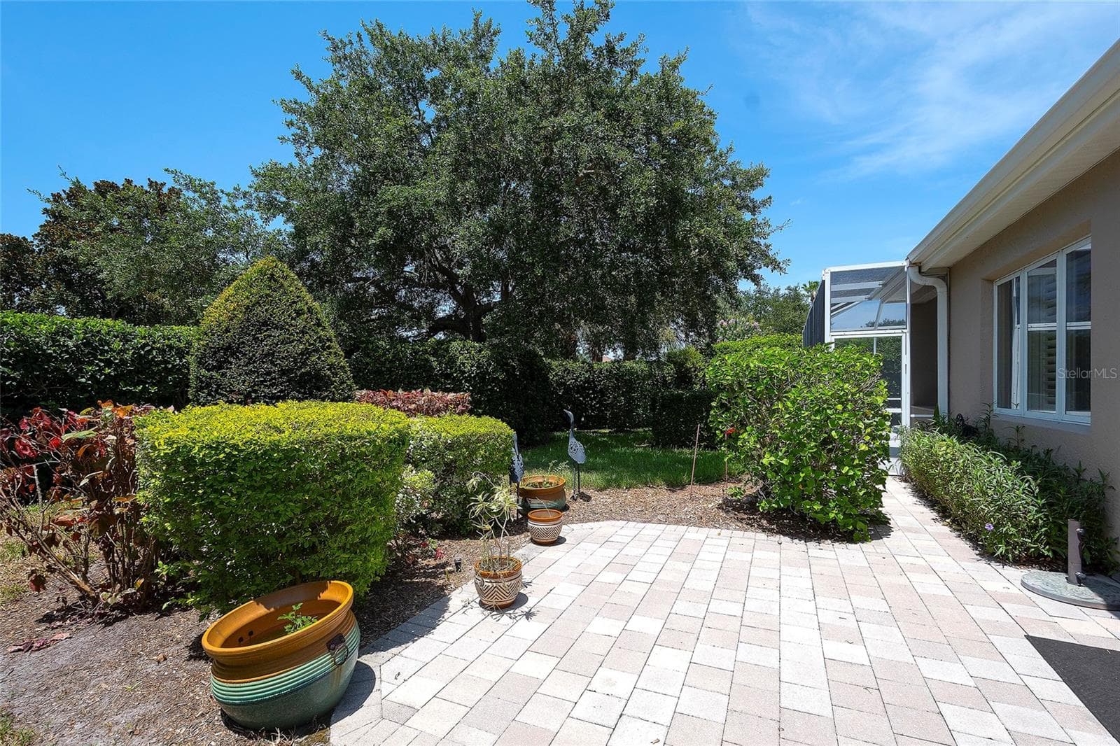 lush tropical plantings - 9735 53RD DR E, BRADENTON