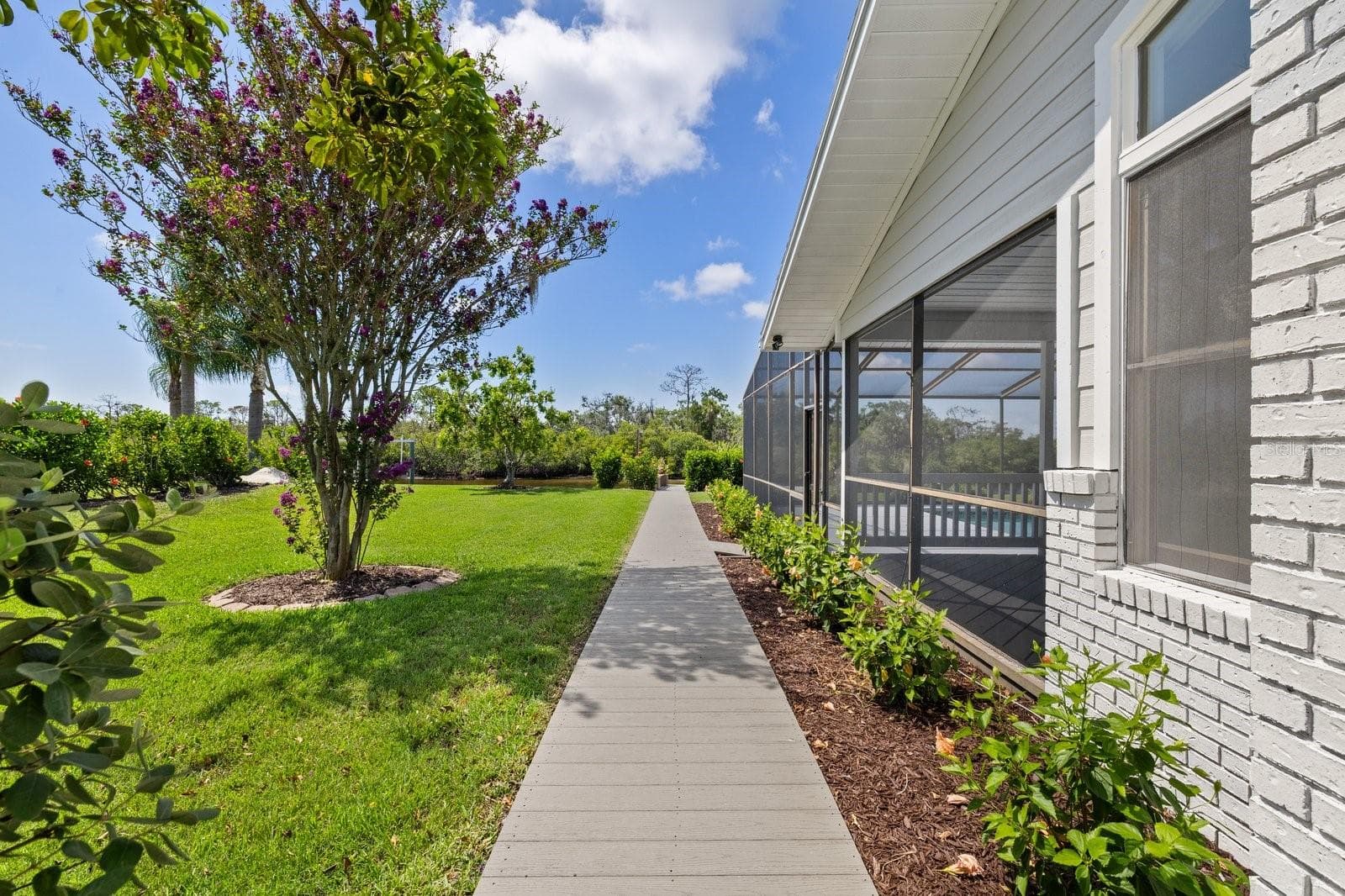 Walkway to Docks from between home and garage near pool. - 5623 HULL CT, NEW PORT RICHEY