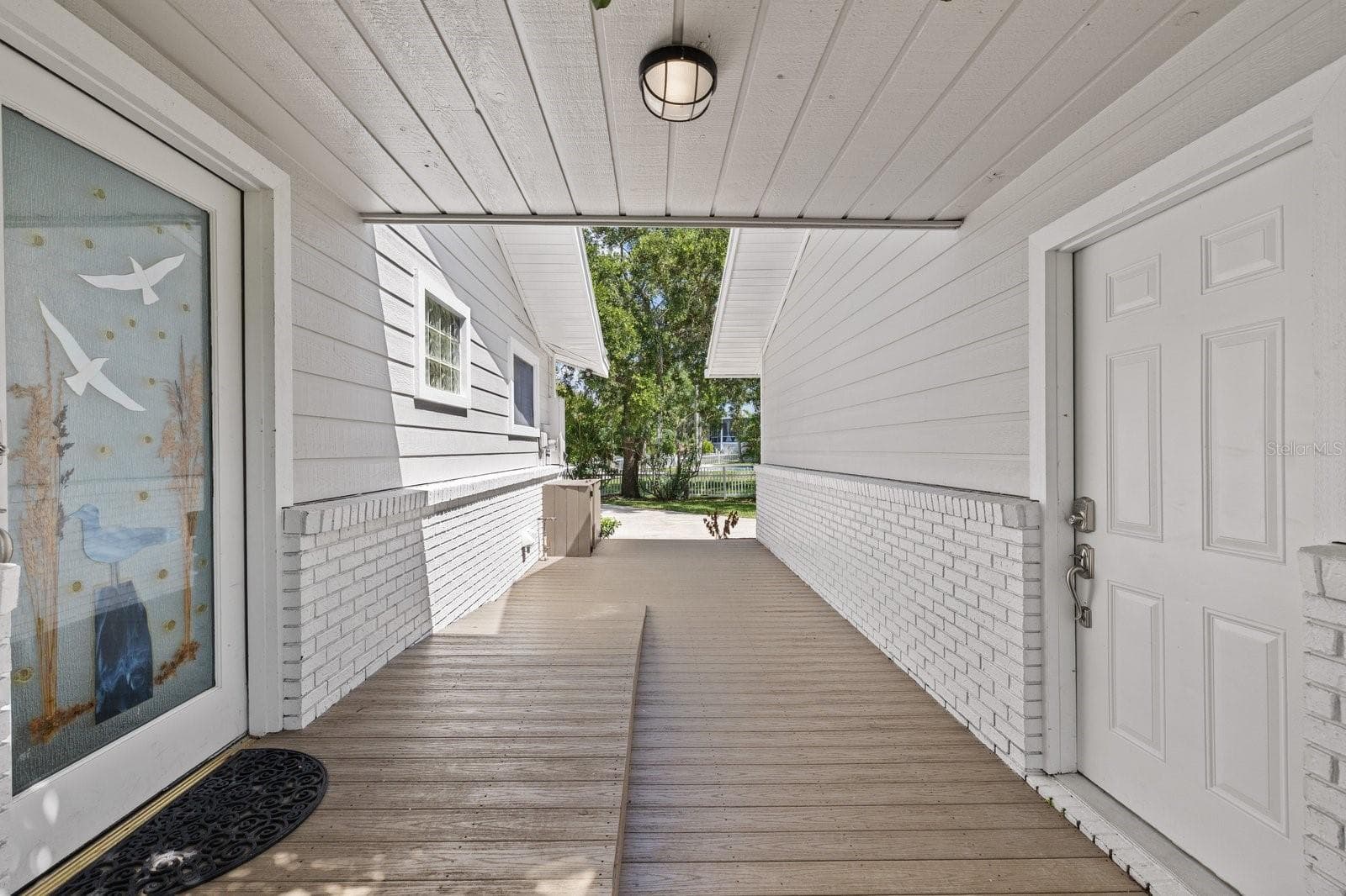 Breezeway between home and garage - 5623 HULL CT, NEW PORT RICHEY