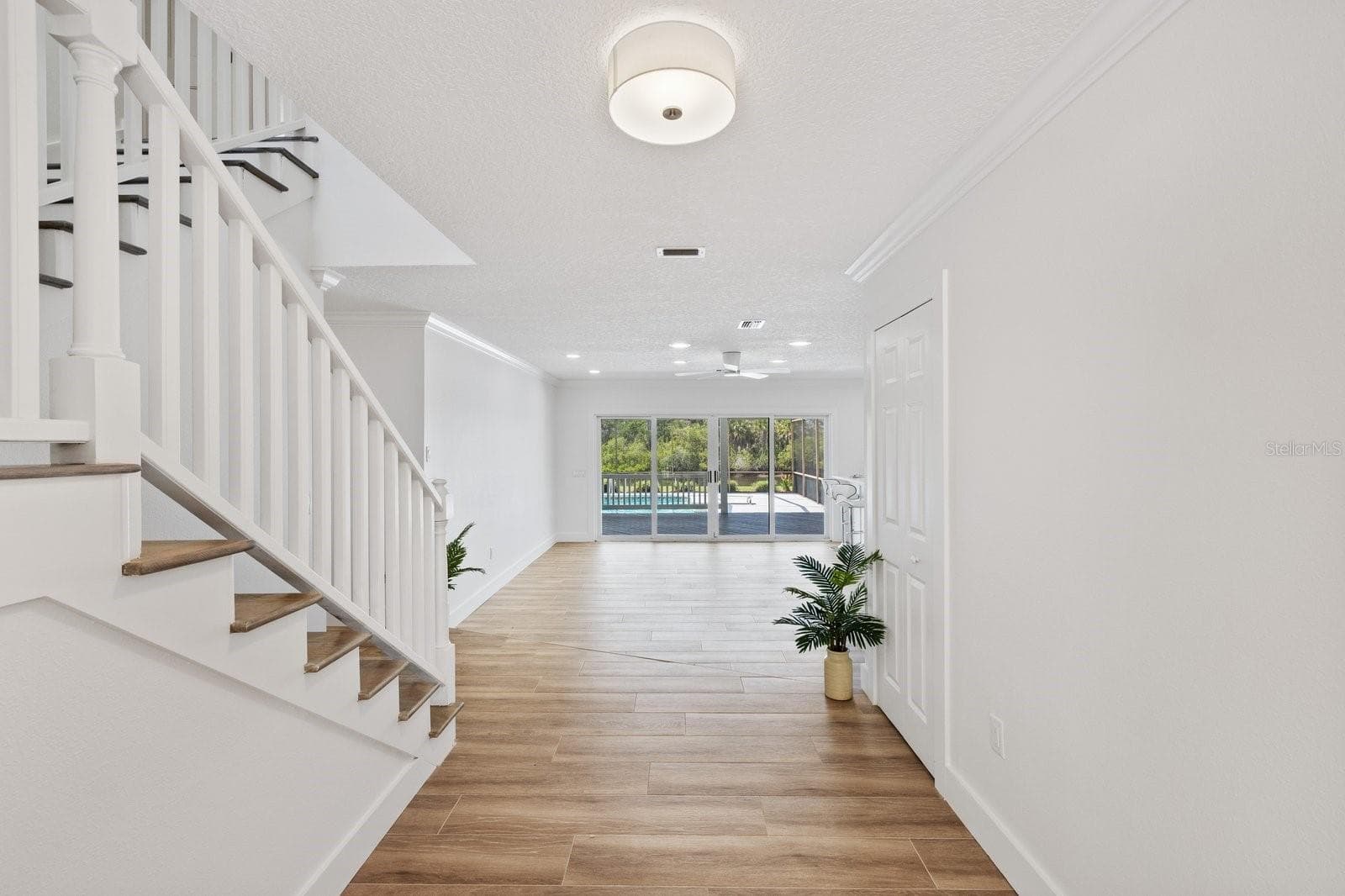 Front Door entry and stair way to 3 bedrooms/2 bathrooms - 5623 HULL CT, NEW PORT RICHEY
