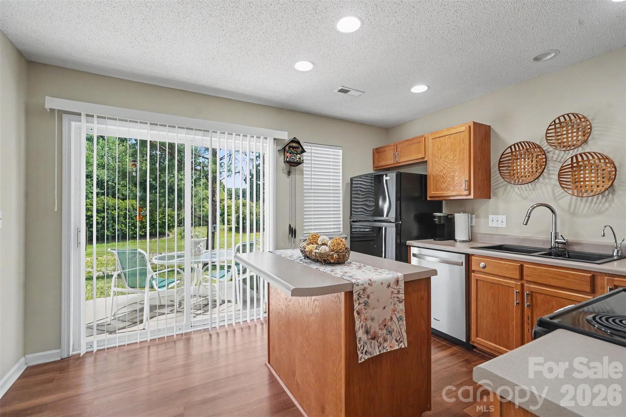 Island kitchen, opens up to backyard with green space - Matthews
