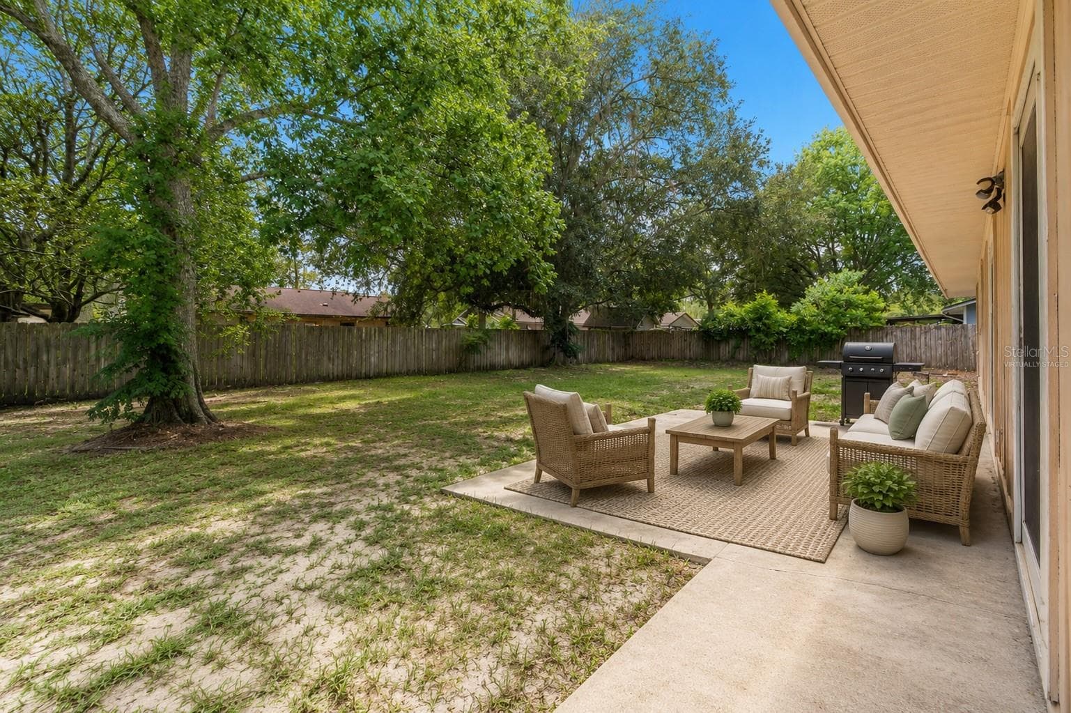 Large Fenced In Backyard with Patio - Virtually Staged - 2541 NW 52ND PL, GAINESVILLE