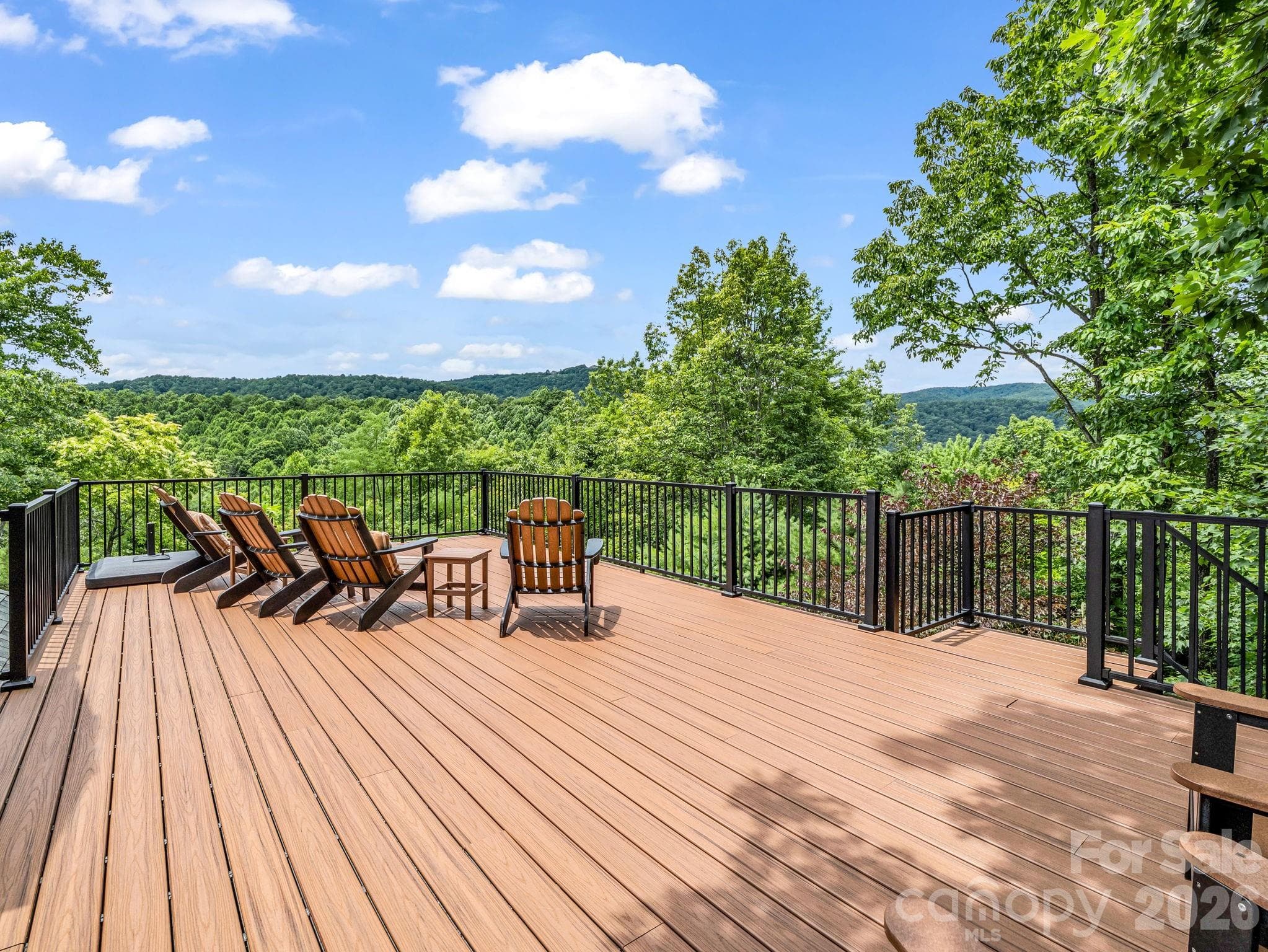 Observatory deck with views to Mt. Mitchell. The tallest peak east of the Mississippi. Large shade umbrella makes this the perfect spot any time of day. Enjoy the relaxing cool mountain temperatures. - Black Mountain