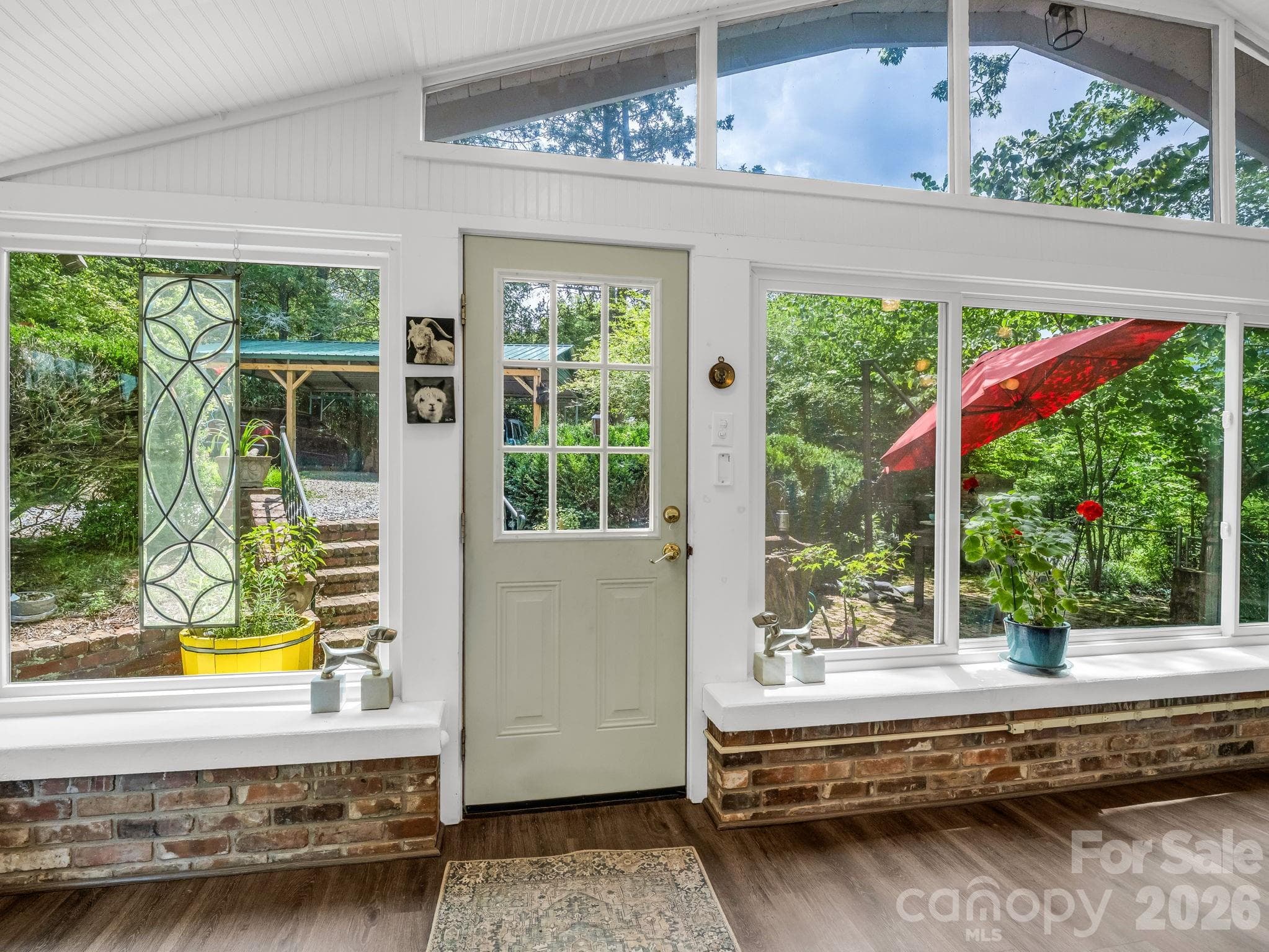 Enjoy the outdoors from this sunroom with abundant natural light. - 23 Sunset Drive, Black Mountain