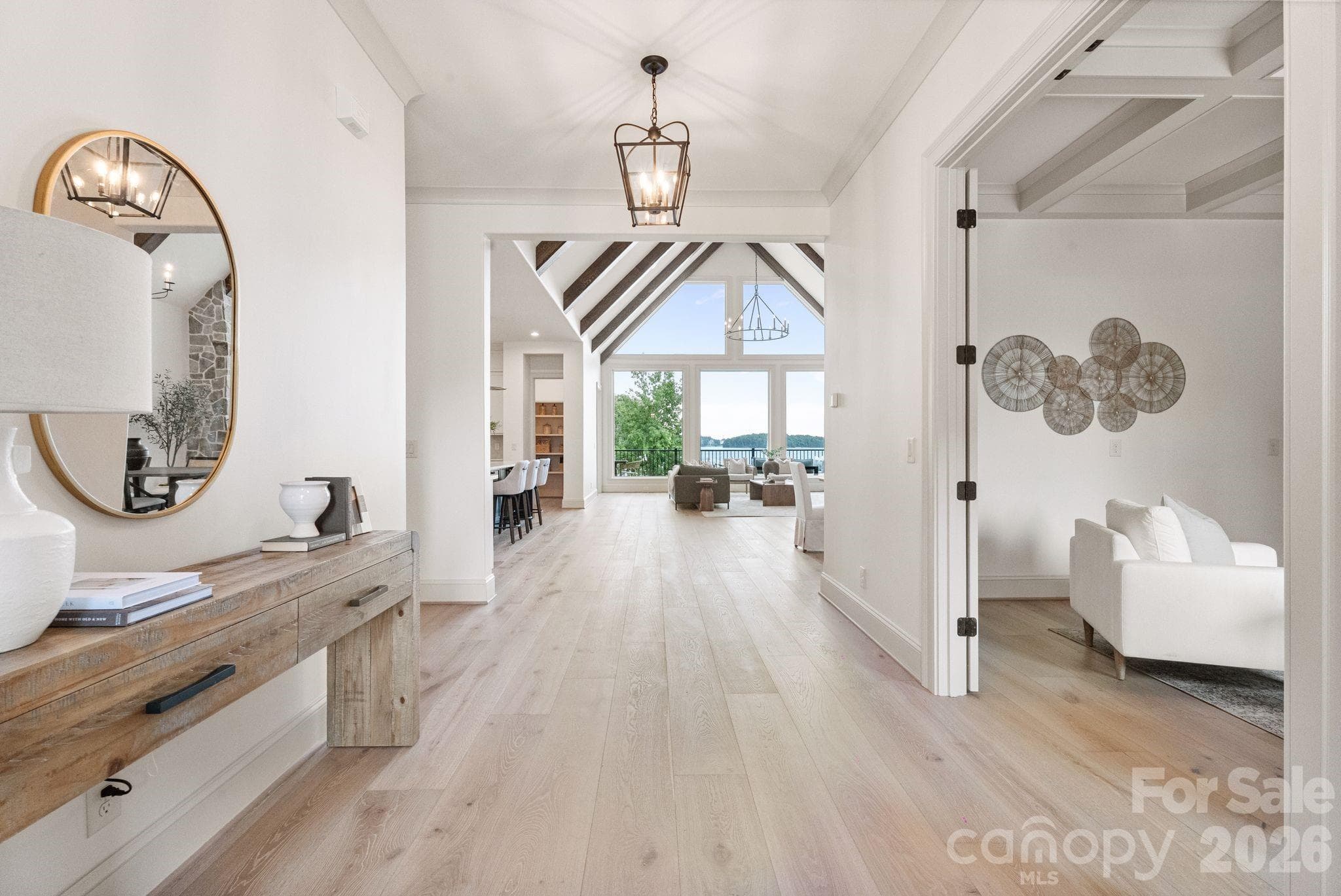 White oak floors and lake views greet you as you enter. - Denver