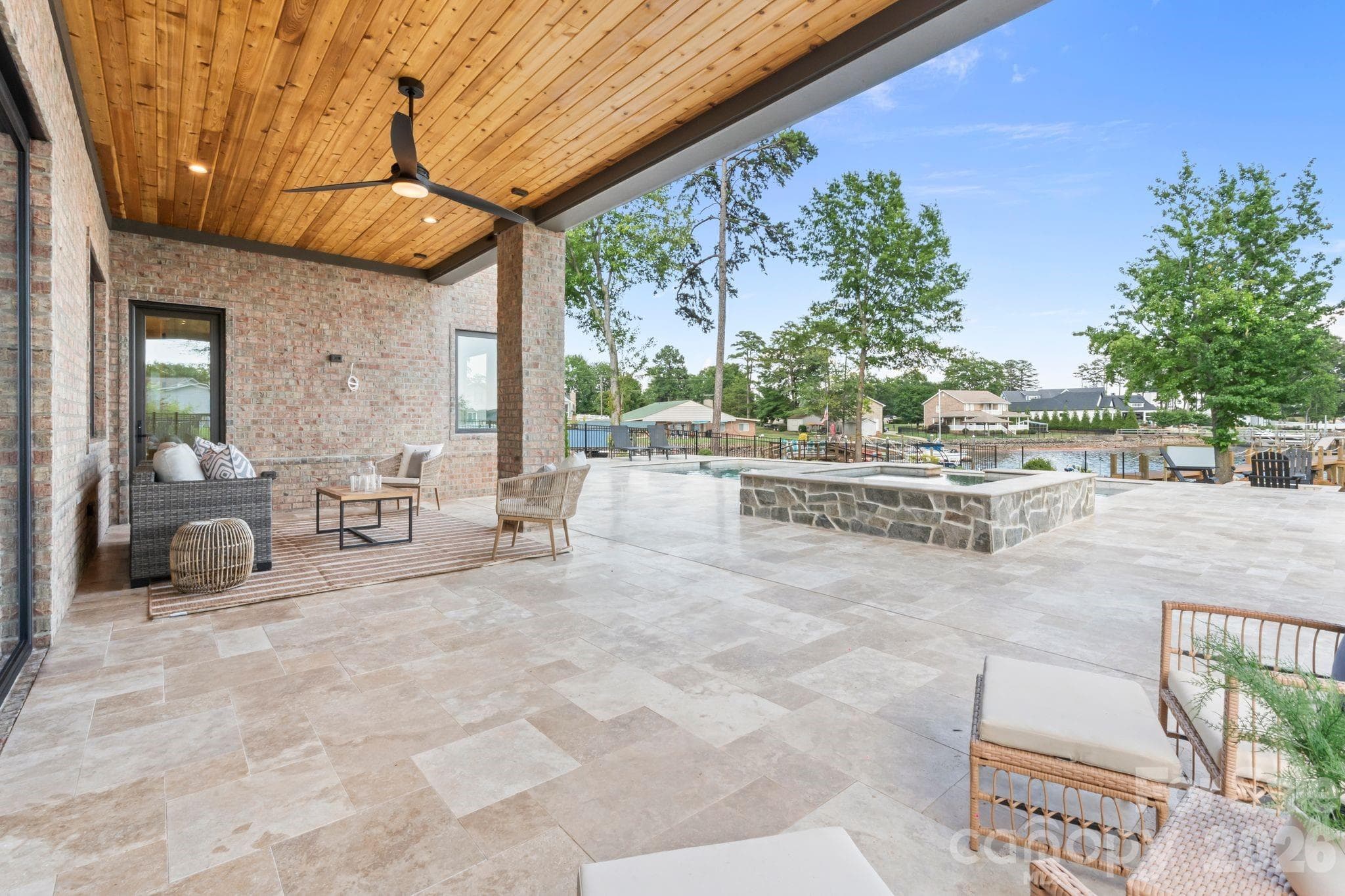 Covered patio with pool and lake views - 2494 Primm Road, Denver