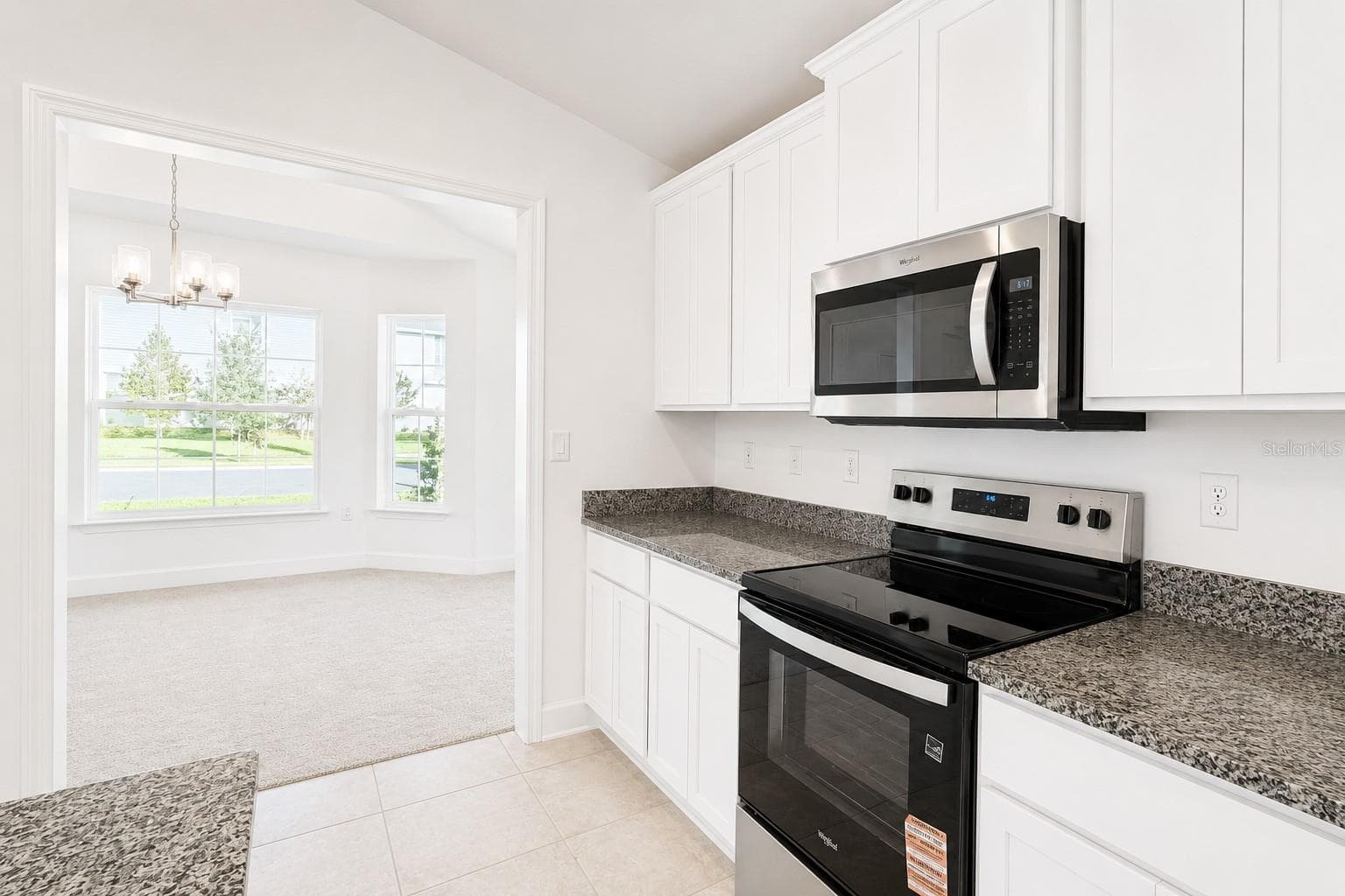 Kitchen Appliances and Dining Area - 7606 BENT TREE LOOP, ST CLOUD
