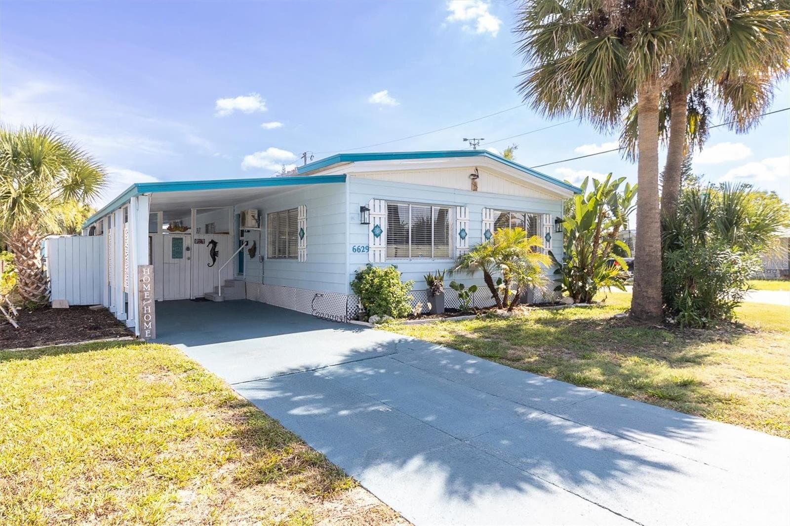 Front of home with carport. - 6629 TOWER DR, HUDSON