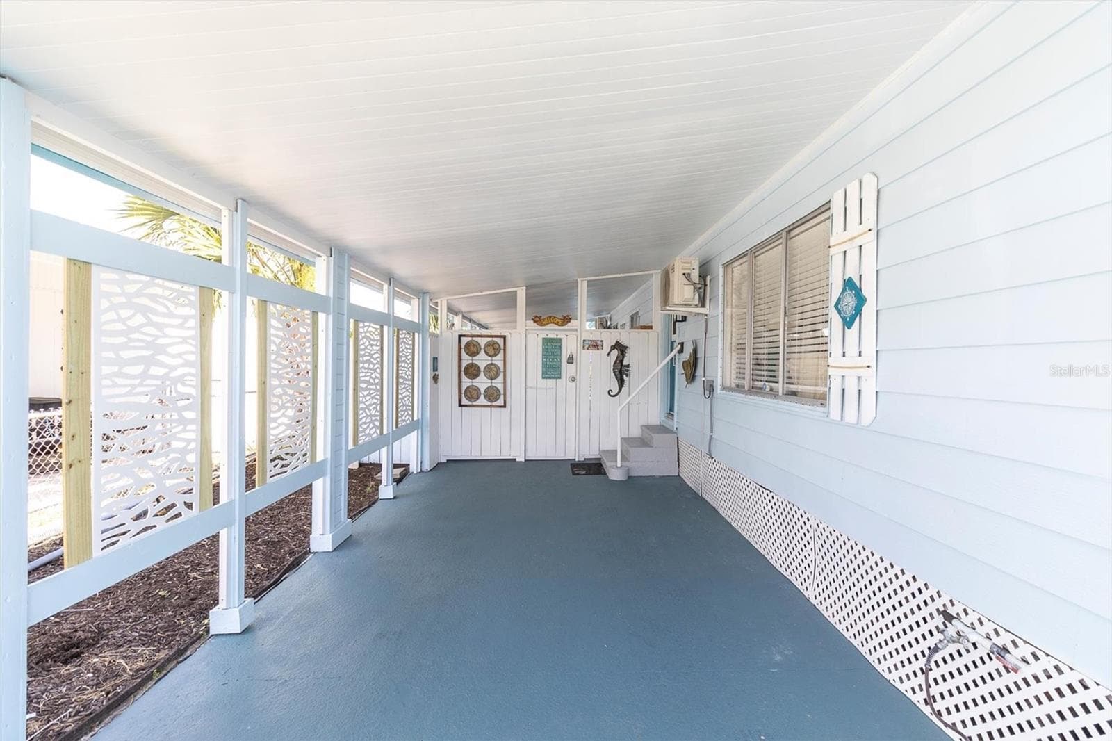 Long, adorable, covered carport. - 6629 TOWER DR, HUDSON