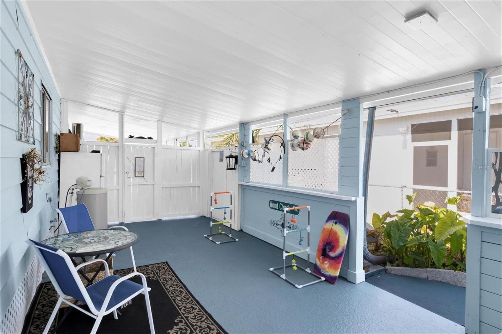 From the covered Breezeway is a Gate out to the carport area. - 6629 TOWER DR, HUDSON