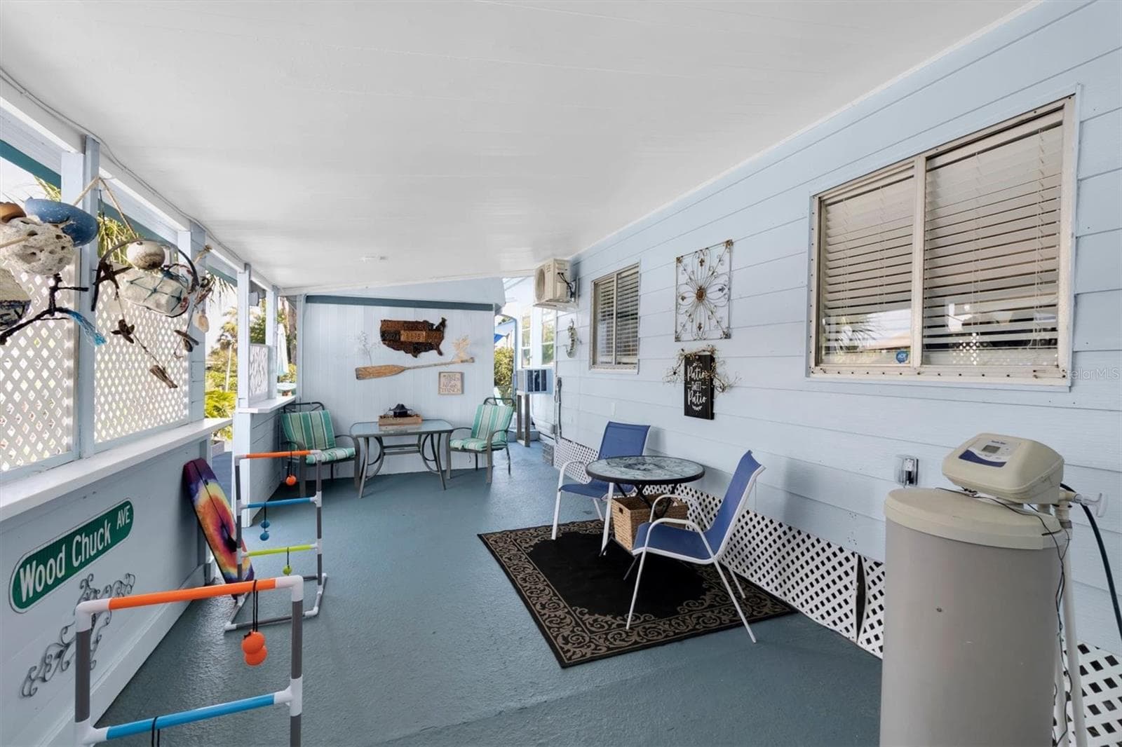 The breezeway is another entertaining area or game area located at the end of the carport. - 6629 TOWER DR, HUDSON