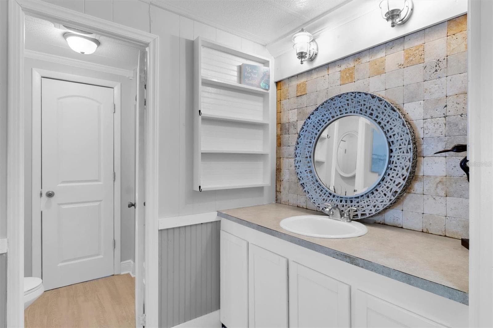 Master Bathroom. Vanity with separate jack & Jill bathroom to the left. Walk in closet is located to the right. - 6629 TOWER DR, HUDSON
