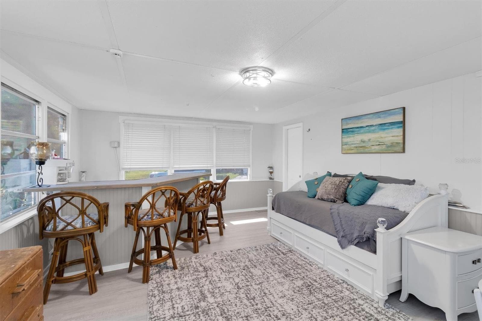 Overlooking the canal is a Large... Florida room that can also be used as a bonus room, or an extra bedroom with with use of the trundle bed, office or just another entertaining area! - 6629 TOWER DR, HUDSON