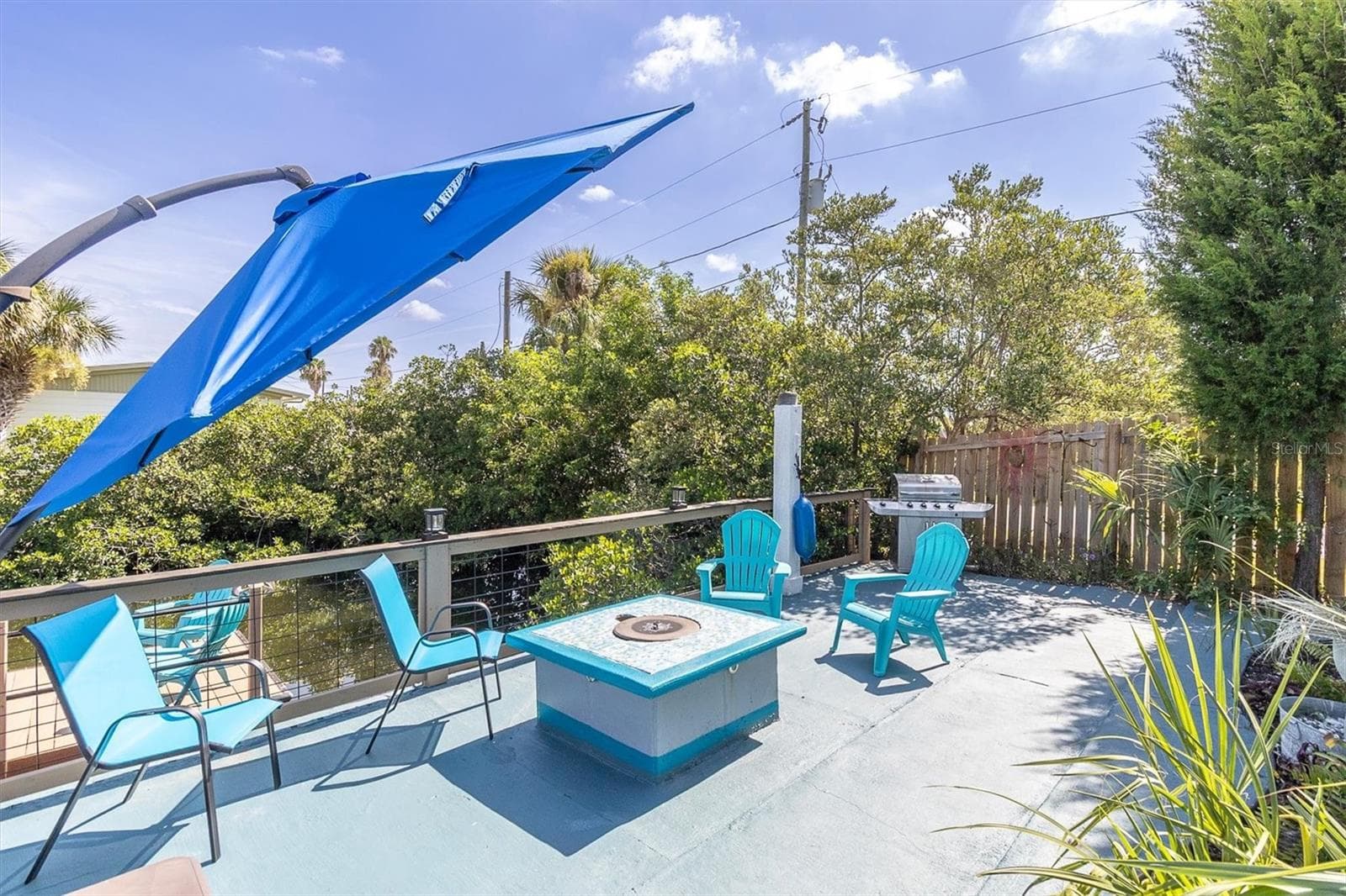 fire pit with a cove to be used as a table. - 6629 TOWER DR, HUDSON