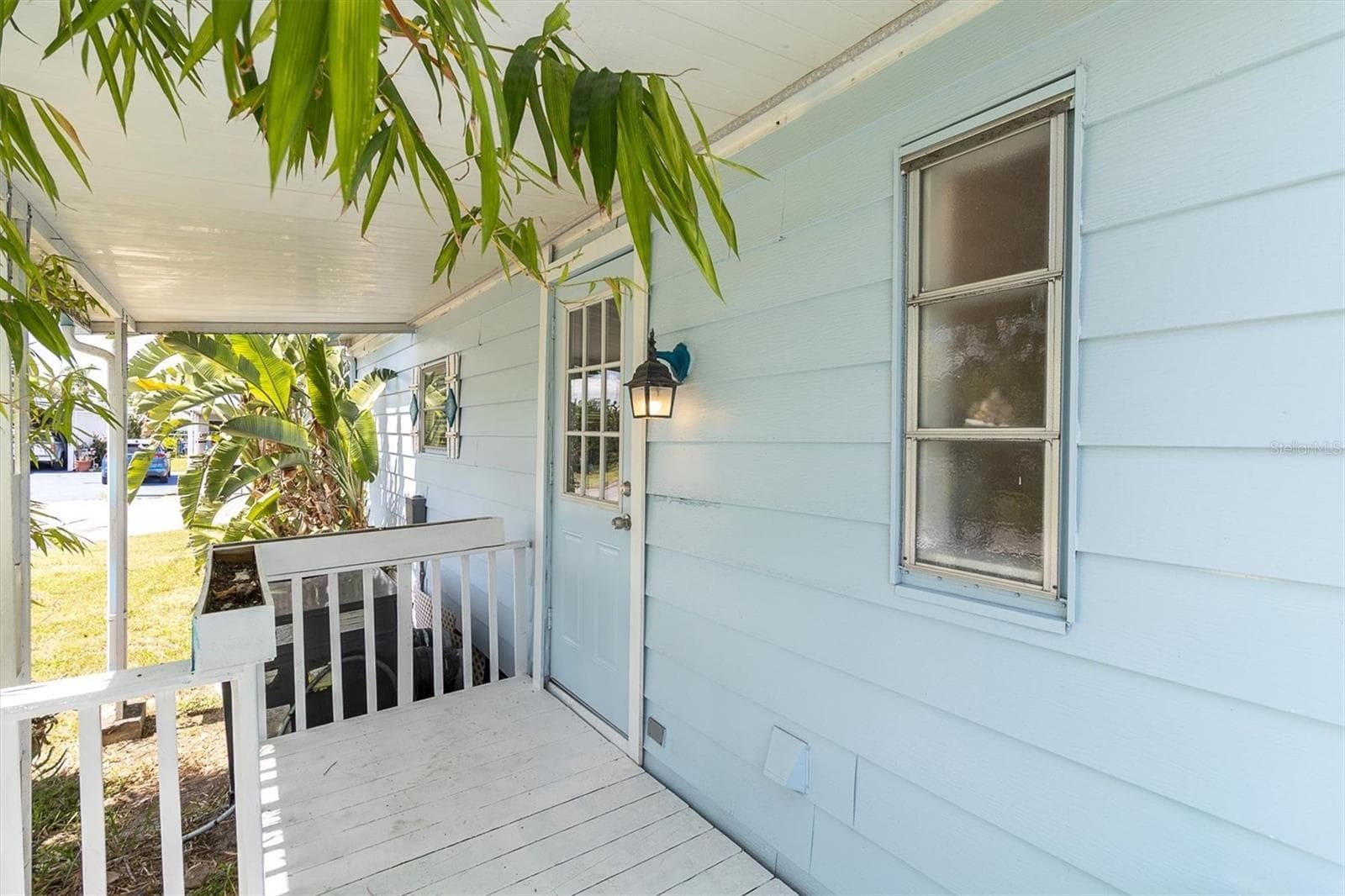 Back door & porch on the side of the house located on keel court side. - 6629 TOWER DR, HUDSON