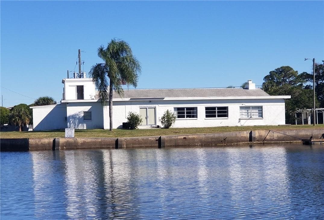 Clubhouse from the water side. - 6629 TOWER DR, HUDSON