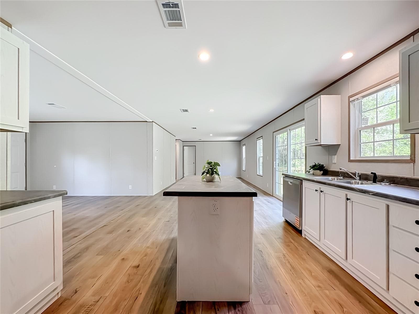 Kitchen to Living and Family Room view - 115 BETSY ROSS PL, SATSUMA