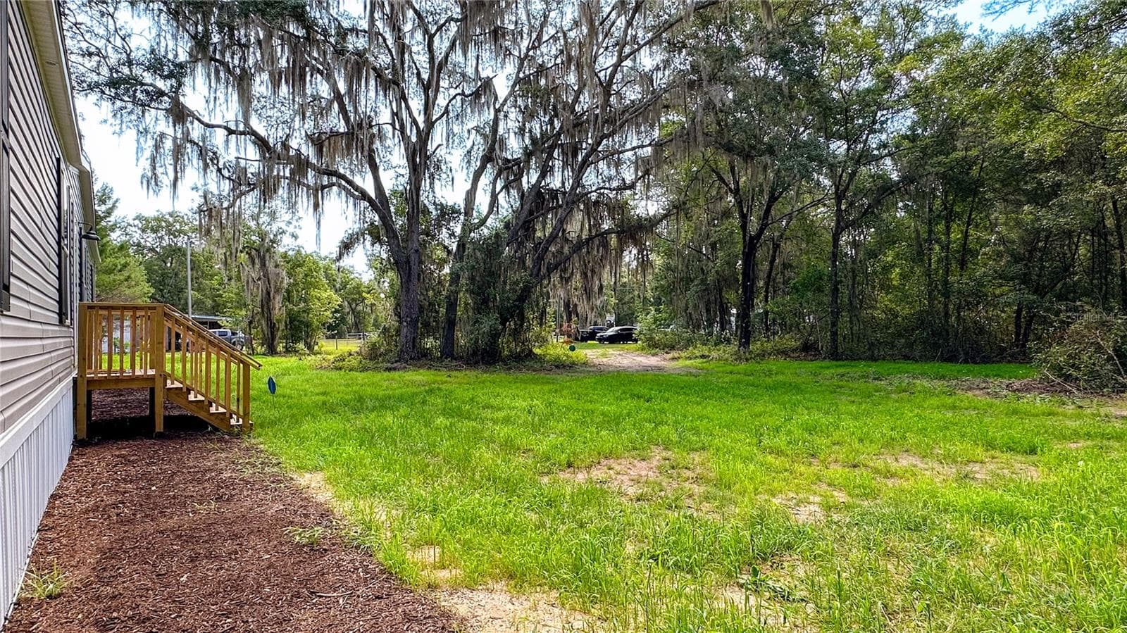 Front of home looking towards private driveway - 115 BETSY ROSS PL, SATSUMA