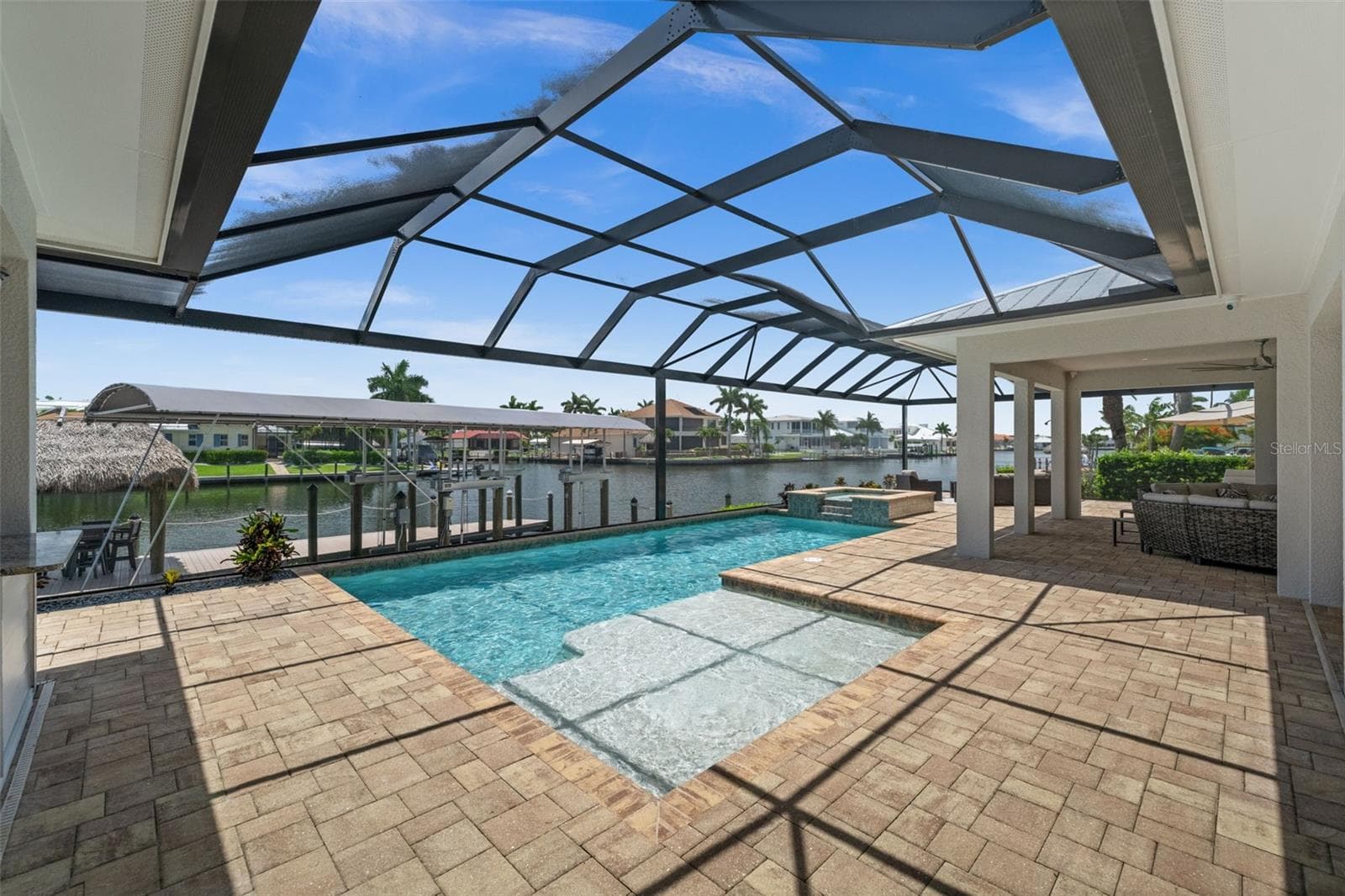 Have a swim while the boats go by - 105 SW 52ND ST, CAPE CORAL