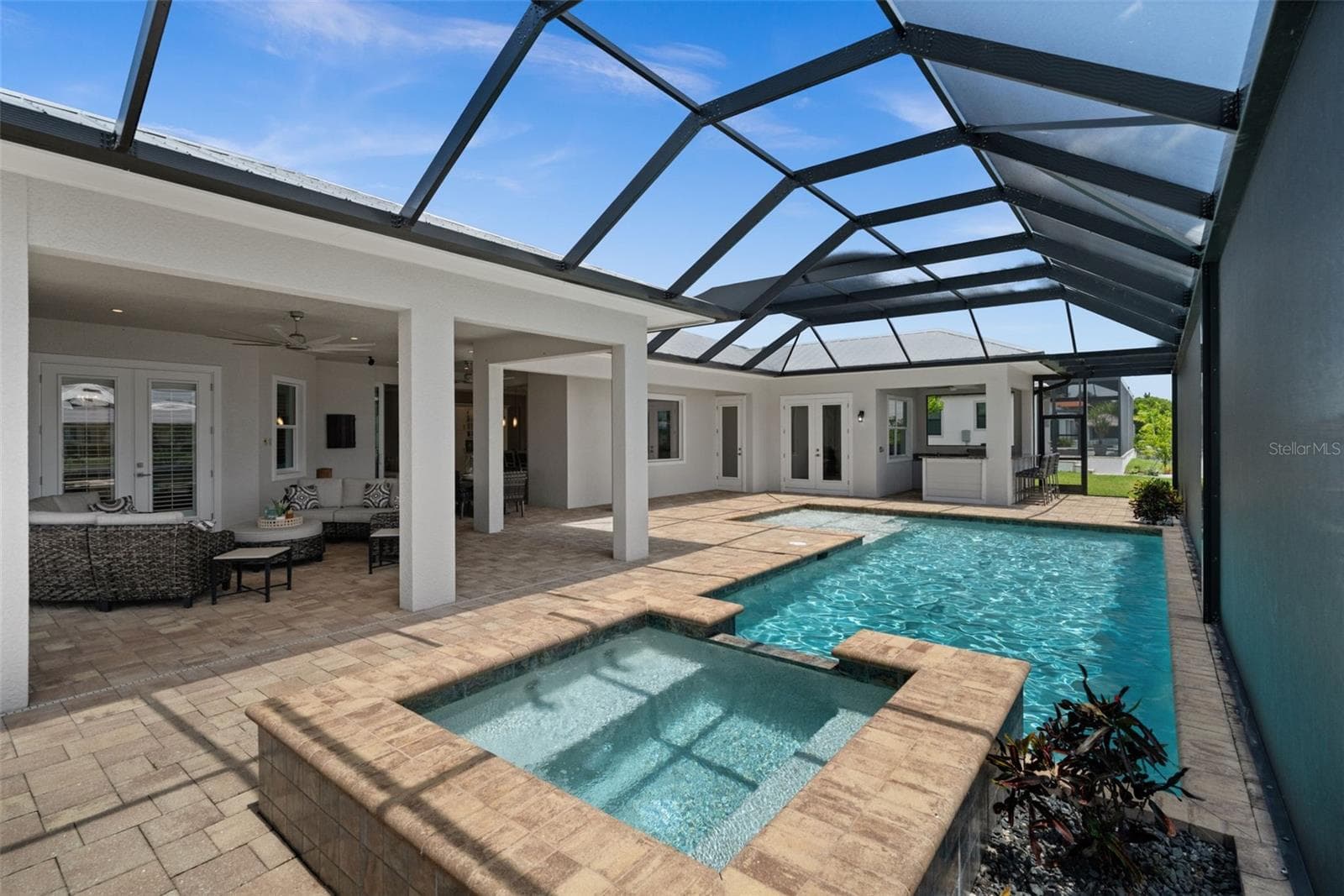 Large heated saltwater pool, spa, outdoor kitchen, huge lanai and lounging area - 105 SW 52ND ST, CAPE CORAL