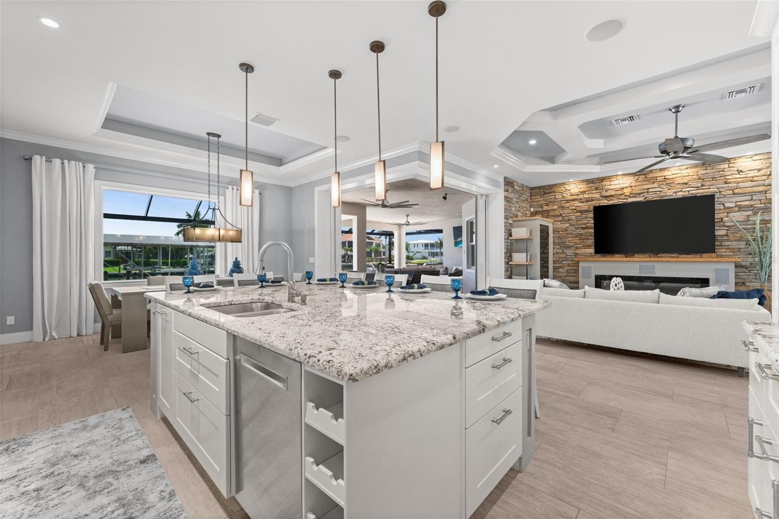 Great views of the water from the kitchen through the 90 degree sliding doors - 105 SW 52ND ST, CAPE CORAL