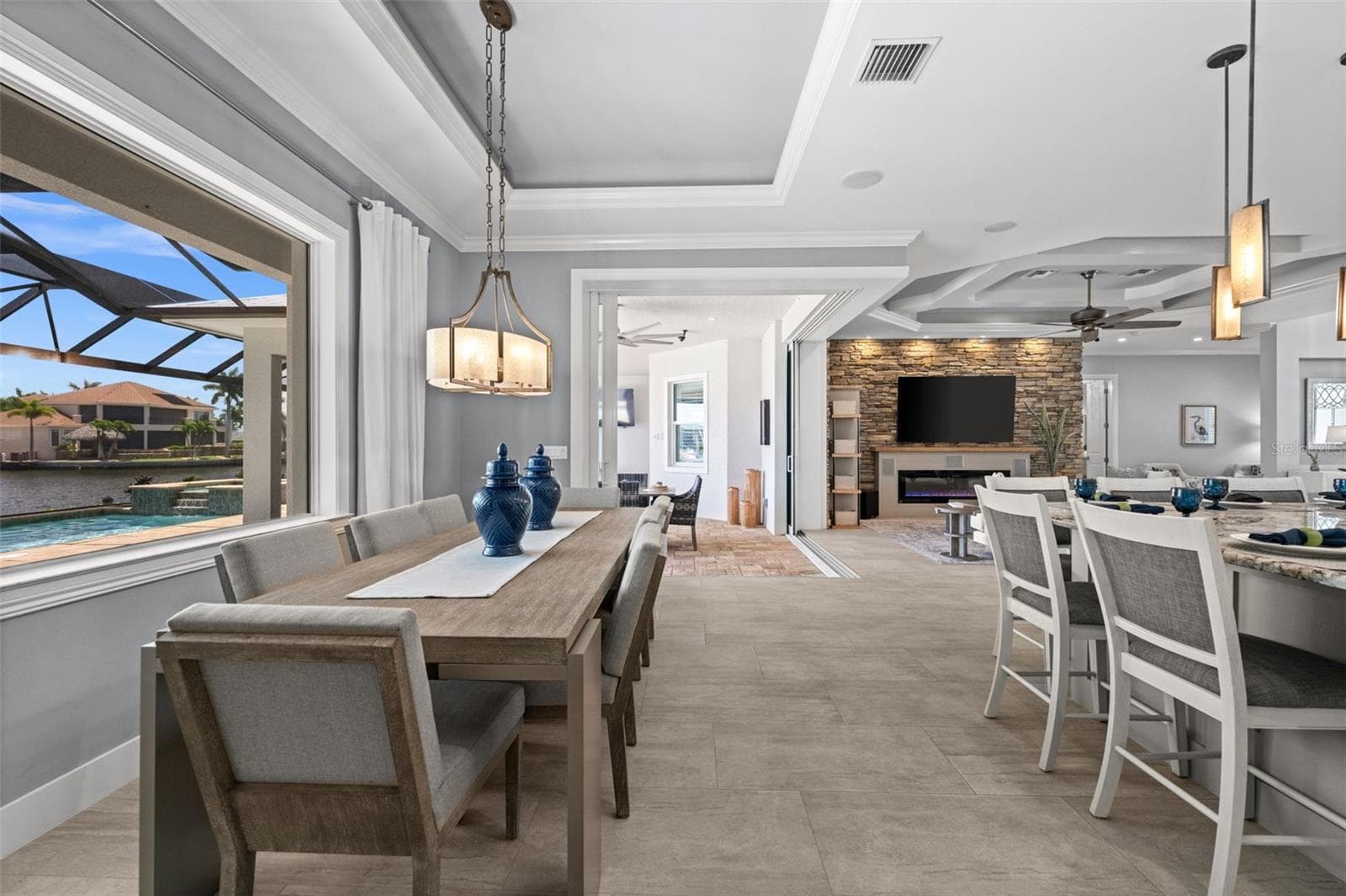 Dining room just steps to the lanai through the 90 degree sliding doors - 105 SW 52ND ST, CAPE CORAL