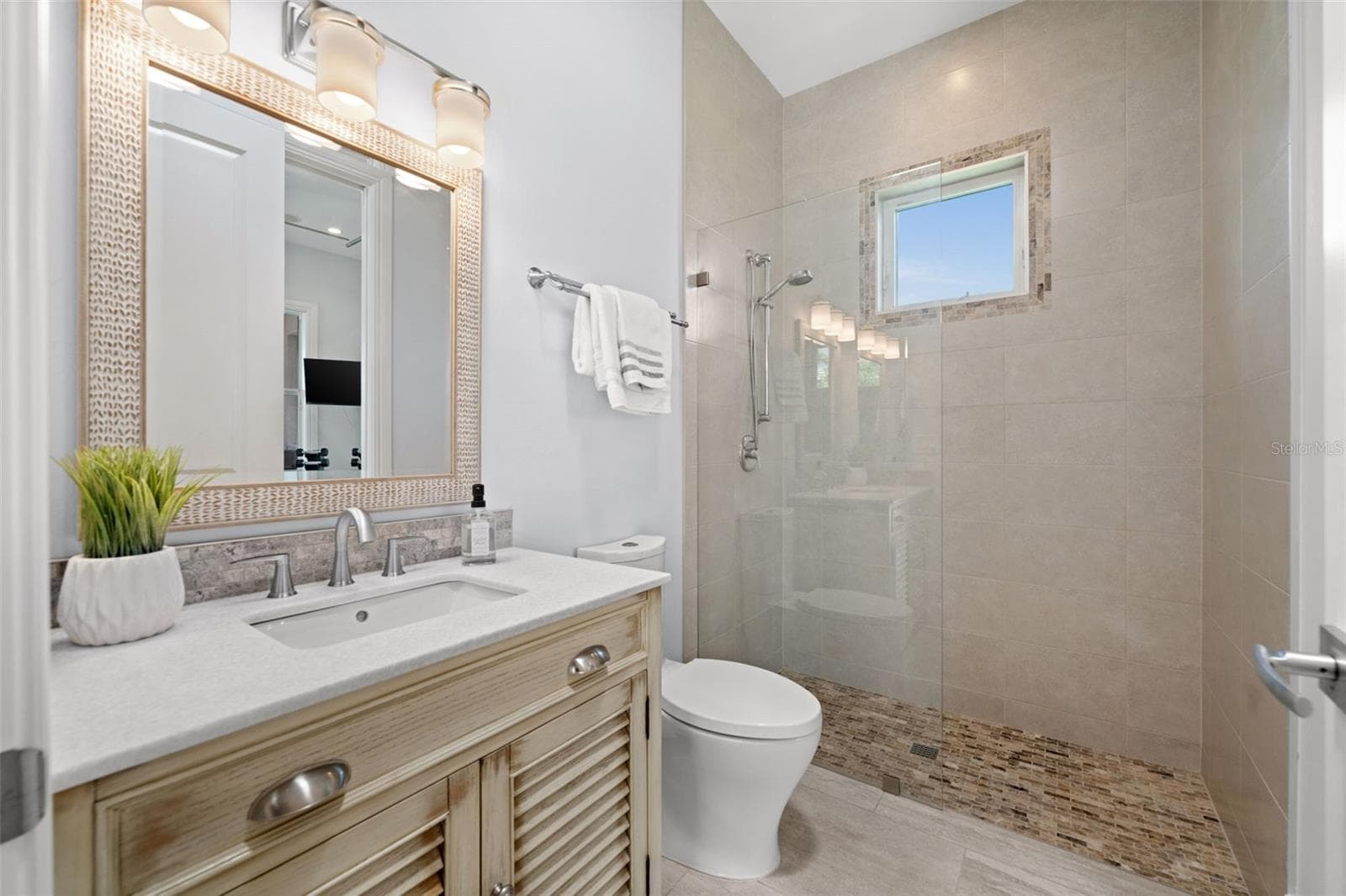 Guest bath (3rd full bath) - 105 SW 52ND ST, CAPE CORAL