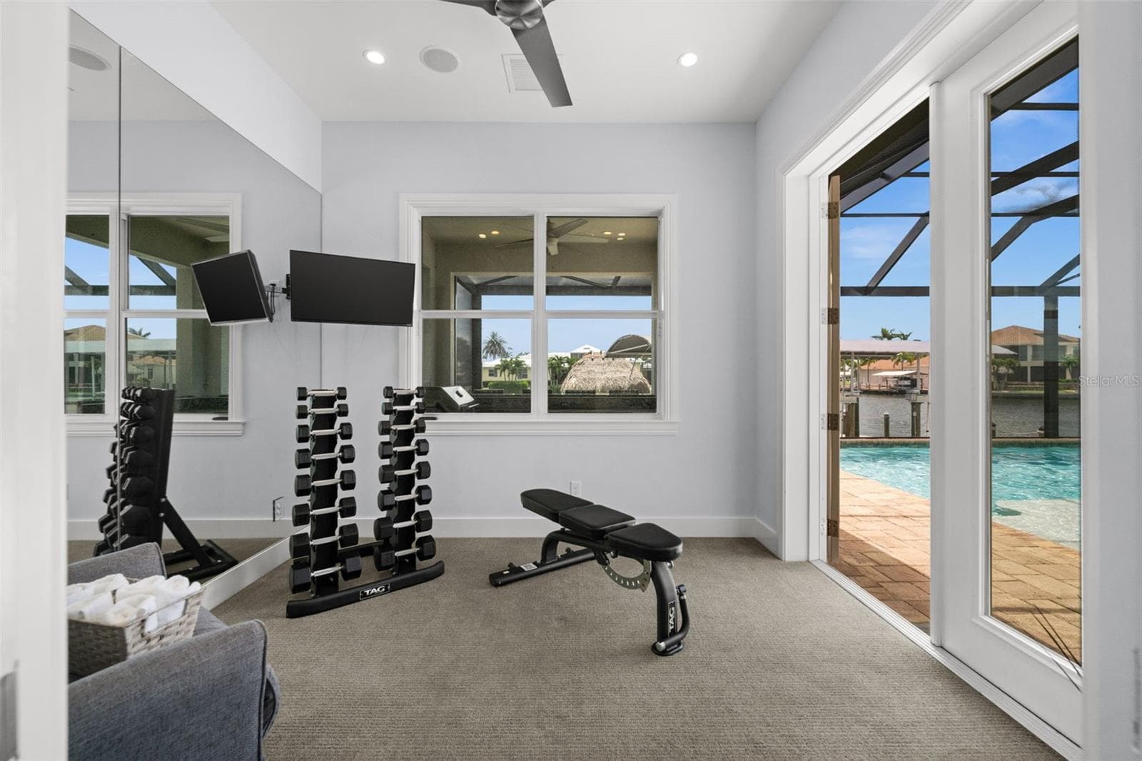 Air conditioned dedicated workout room or office with direct access to the pool and lanai - 105 SW 52ND ST, CAPE CORAL