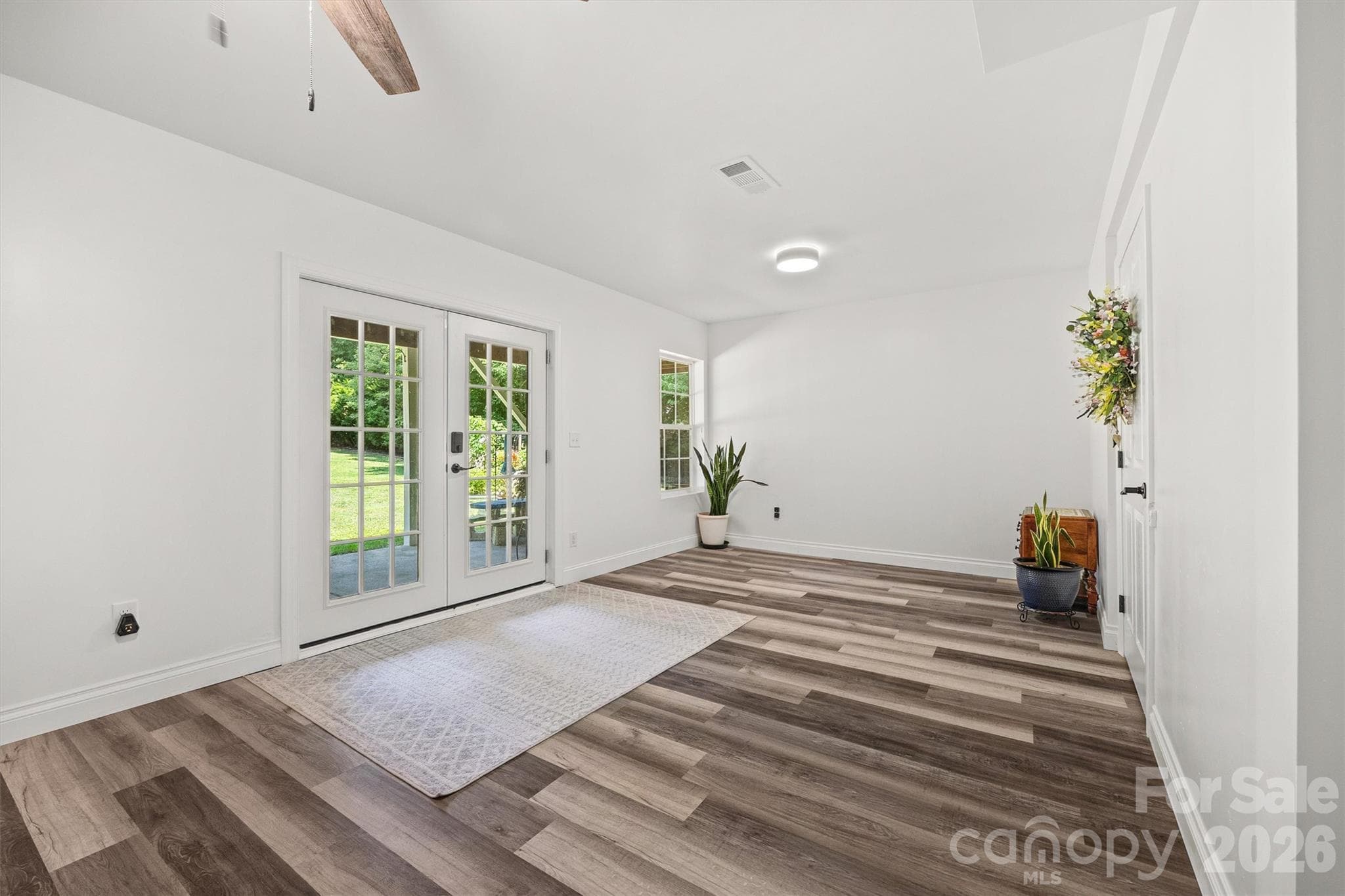 Entryway to outside and French doors to 2nd living quarters. - 121 Isle Run Drive, Mooresville