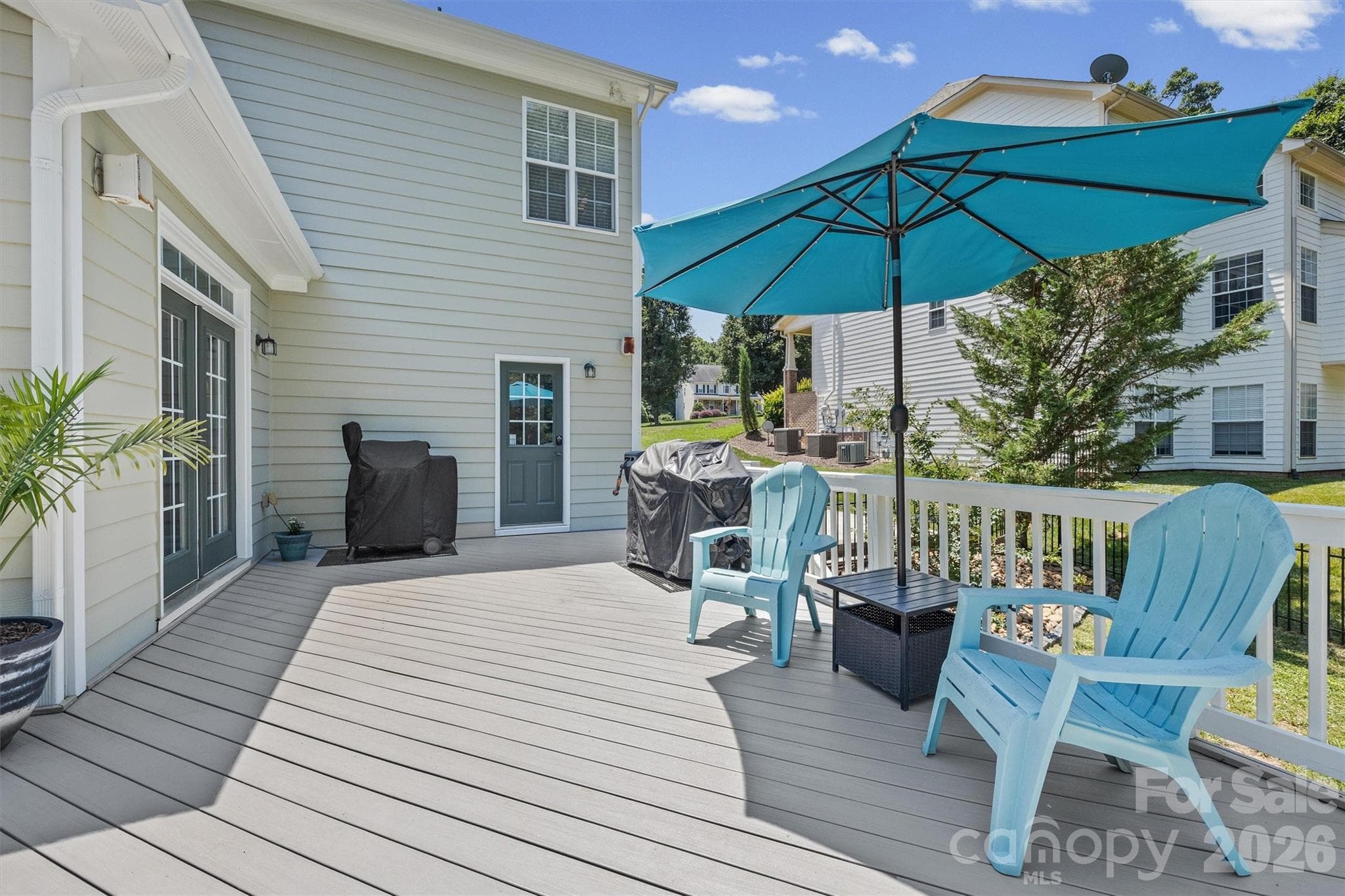 New Composite Deck runs along back of house - 121 Isle Run Drive, Mooresville