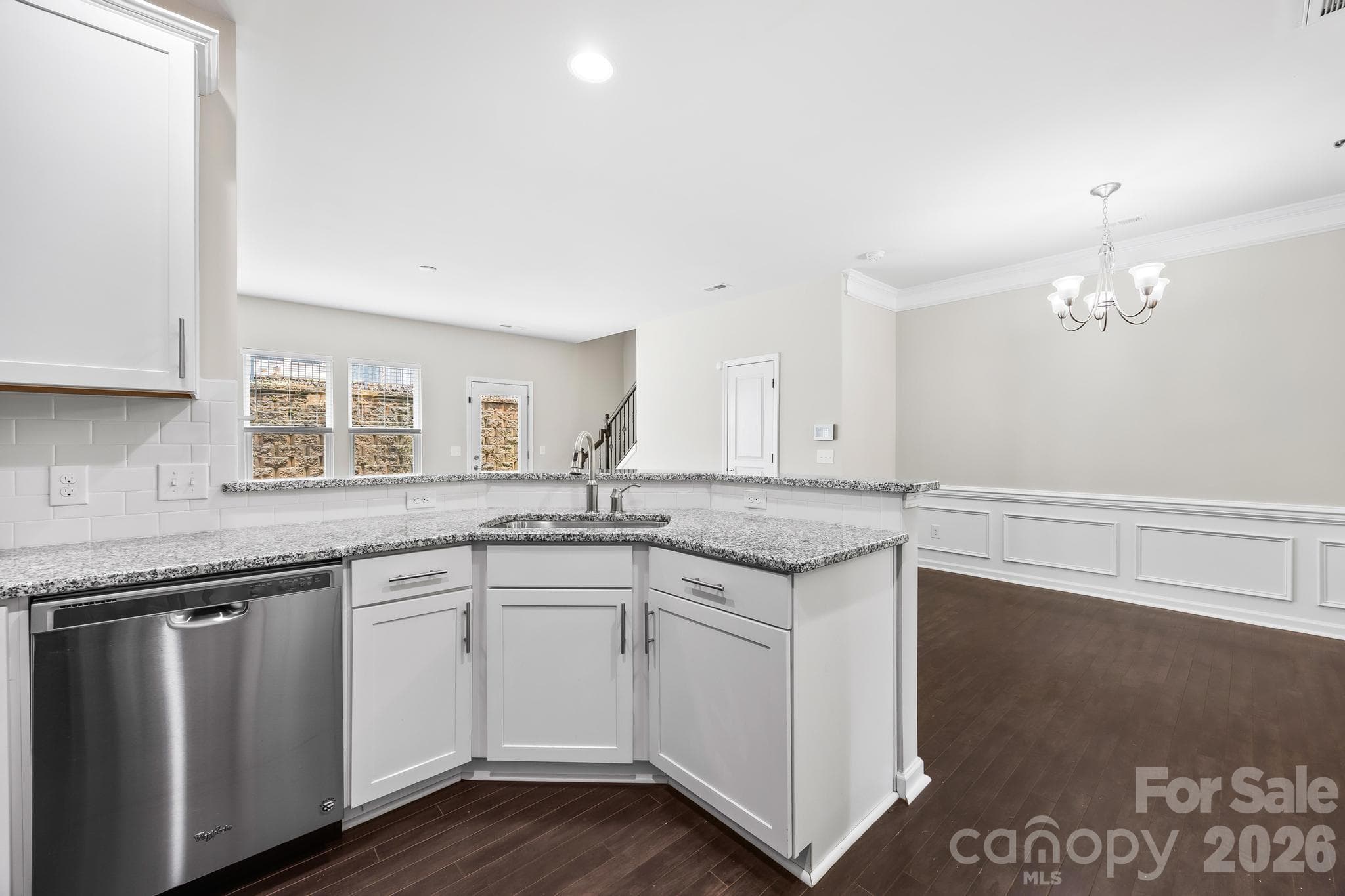 Beautiful kitchen overlooks dining area and living room for seamless living and entertaining. - Charlotte