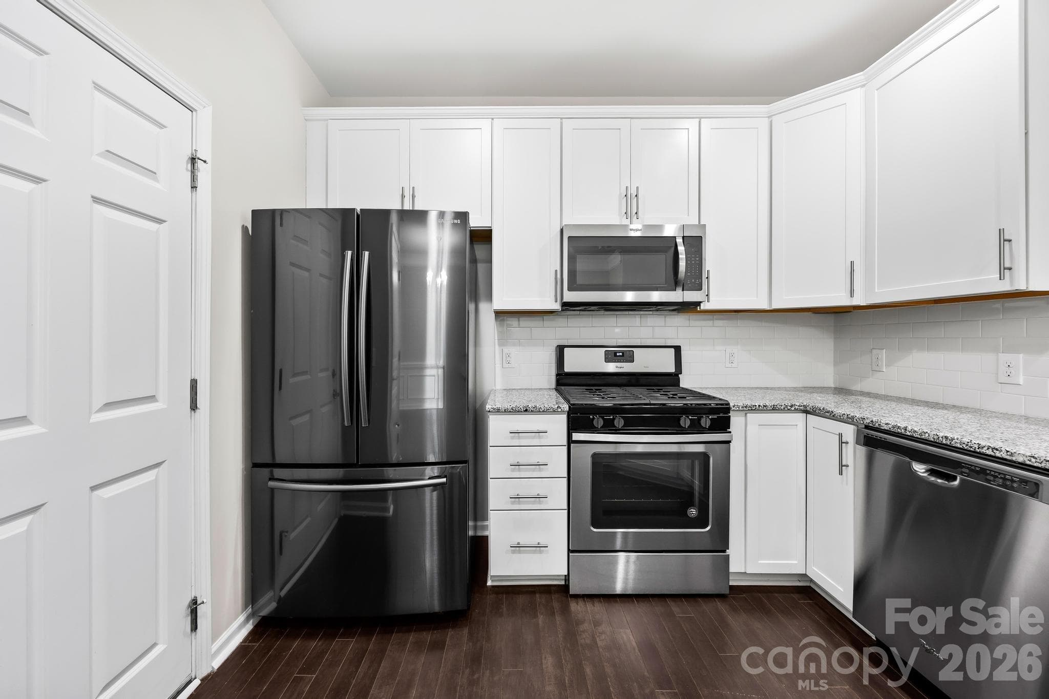 Whether preparing a weeknight dinner or hosting guests, this kitchen combines timeless finishes with everyday functionality. - Charlotte