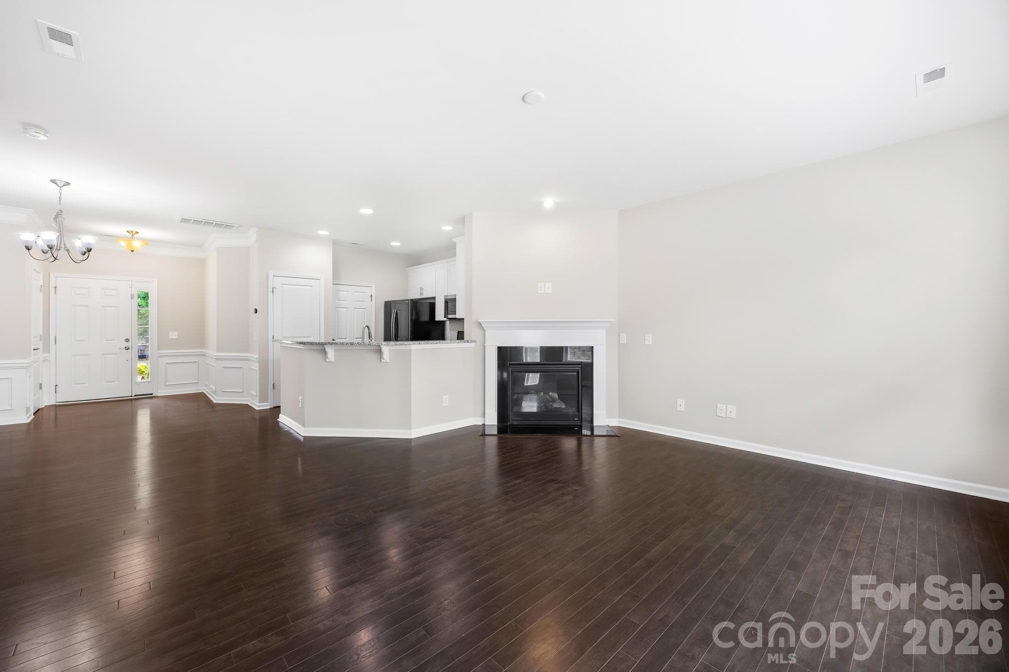 Enjoy this open and inviting floor plan featuring hardwood floors throughout both levels and fresh interior paint. - Charlotte