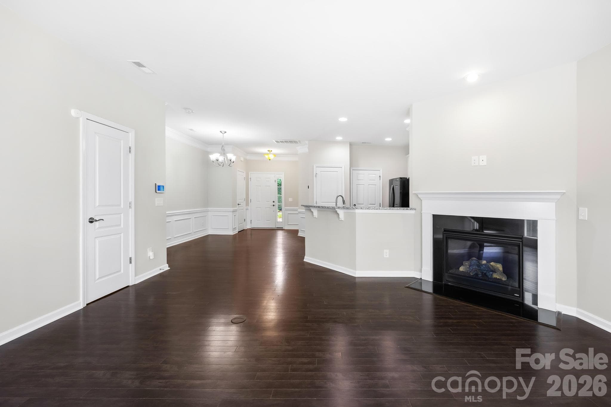 Designed for effortless everyday living, the open-concept layout flows seamlessly from the living area into the kitchen and dining spaces. - Charlotte