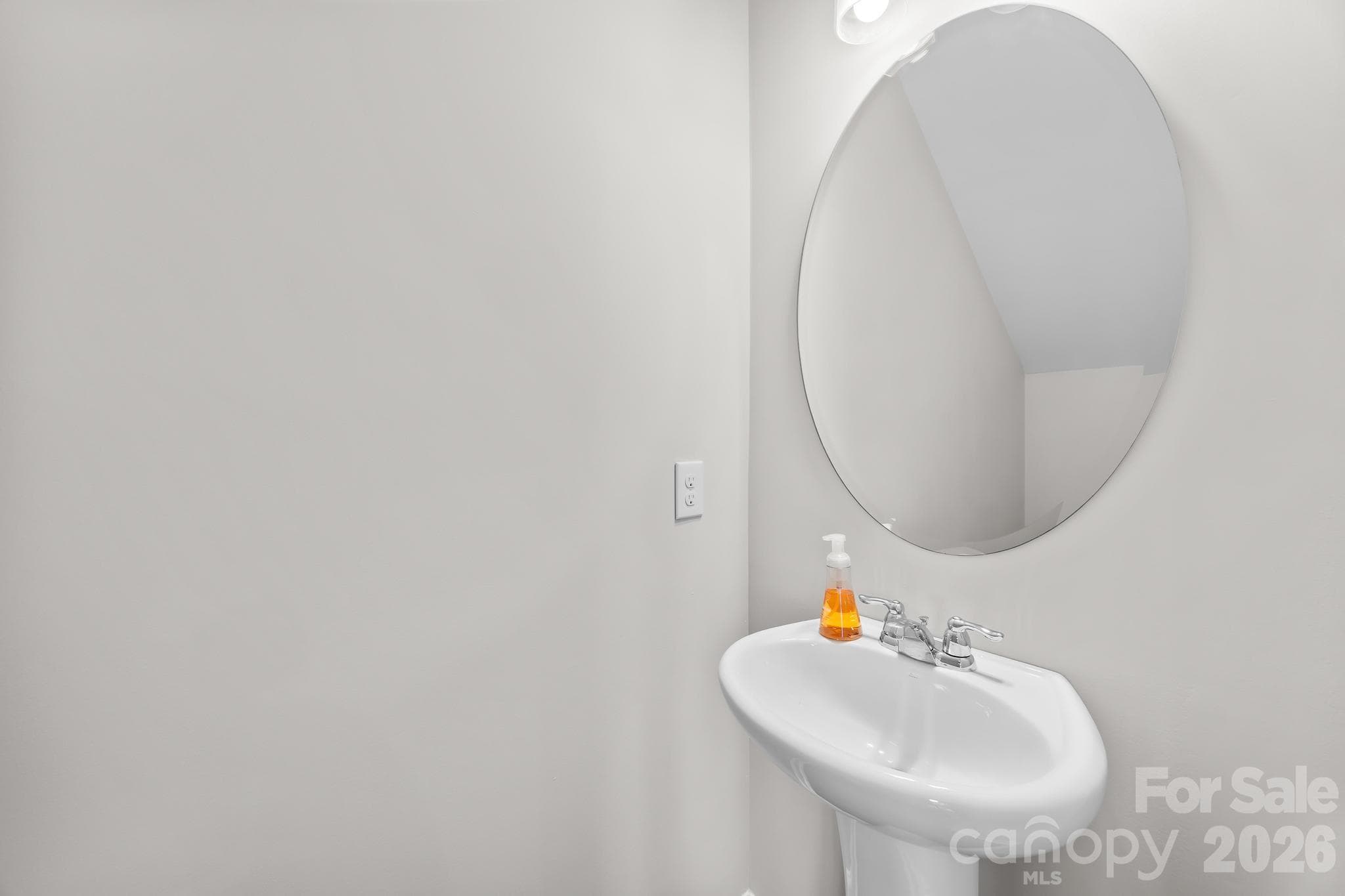 A conveniently located main-level powder room adds comfort and convenience for both homeowners and guests. - Charlotte