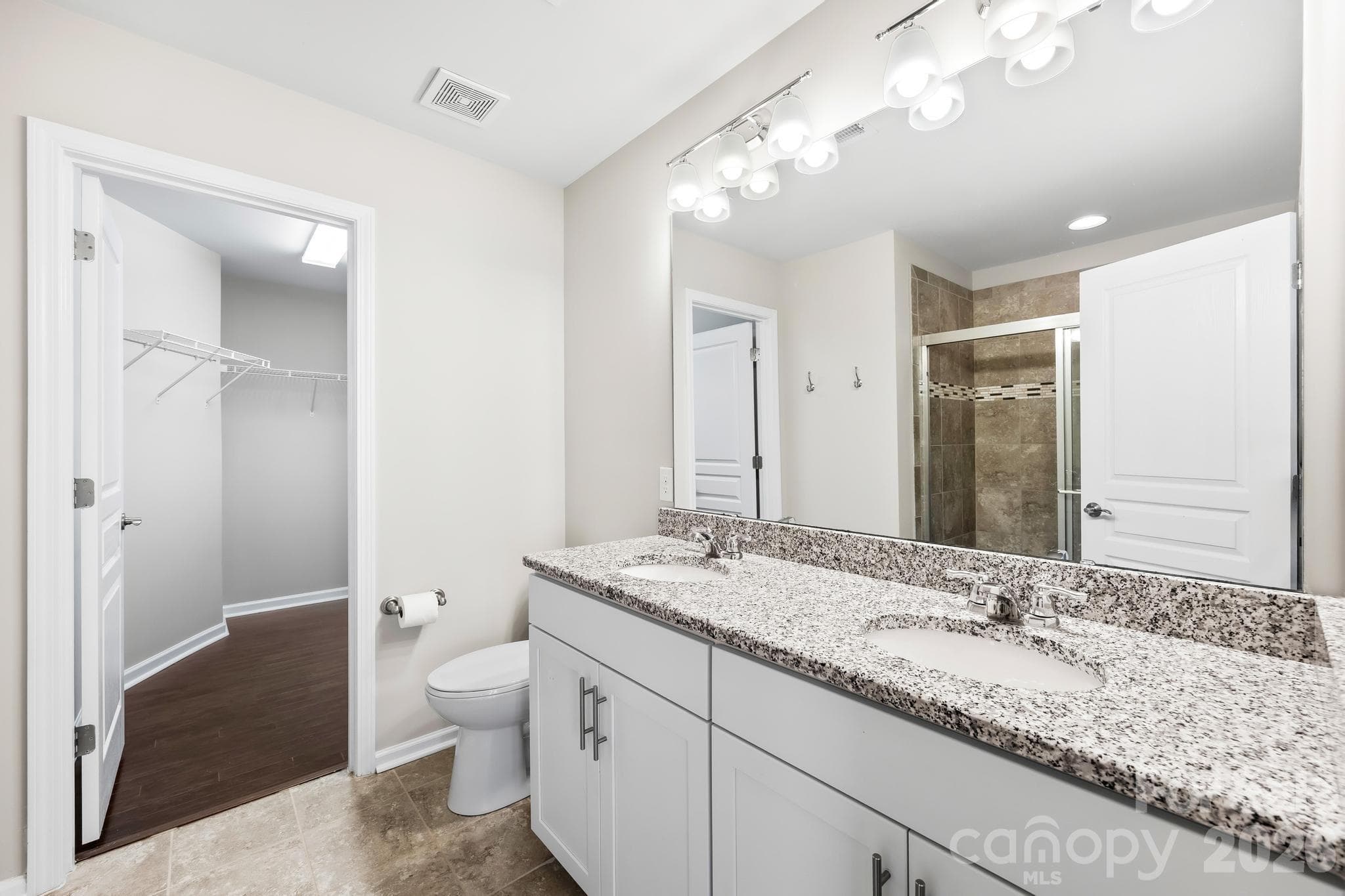 The private en-suite bath provides the perfect space to begin and end each day. - Charlotte