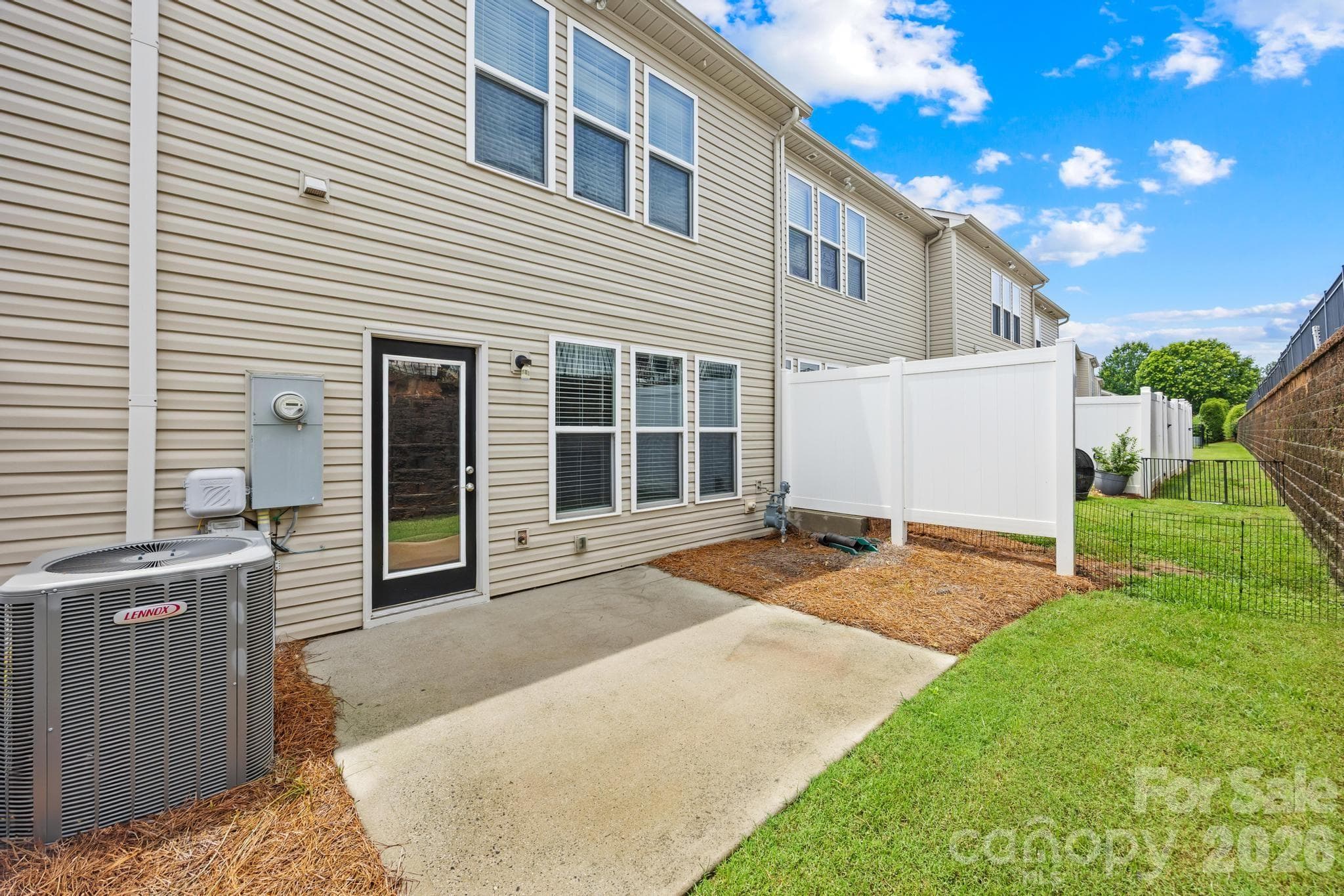 Relax outdoors on the private patio — perfect for morning coffee, grilling, or unwinding after a busy day. - Charlotte